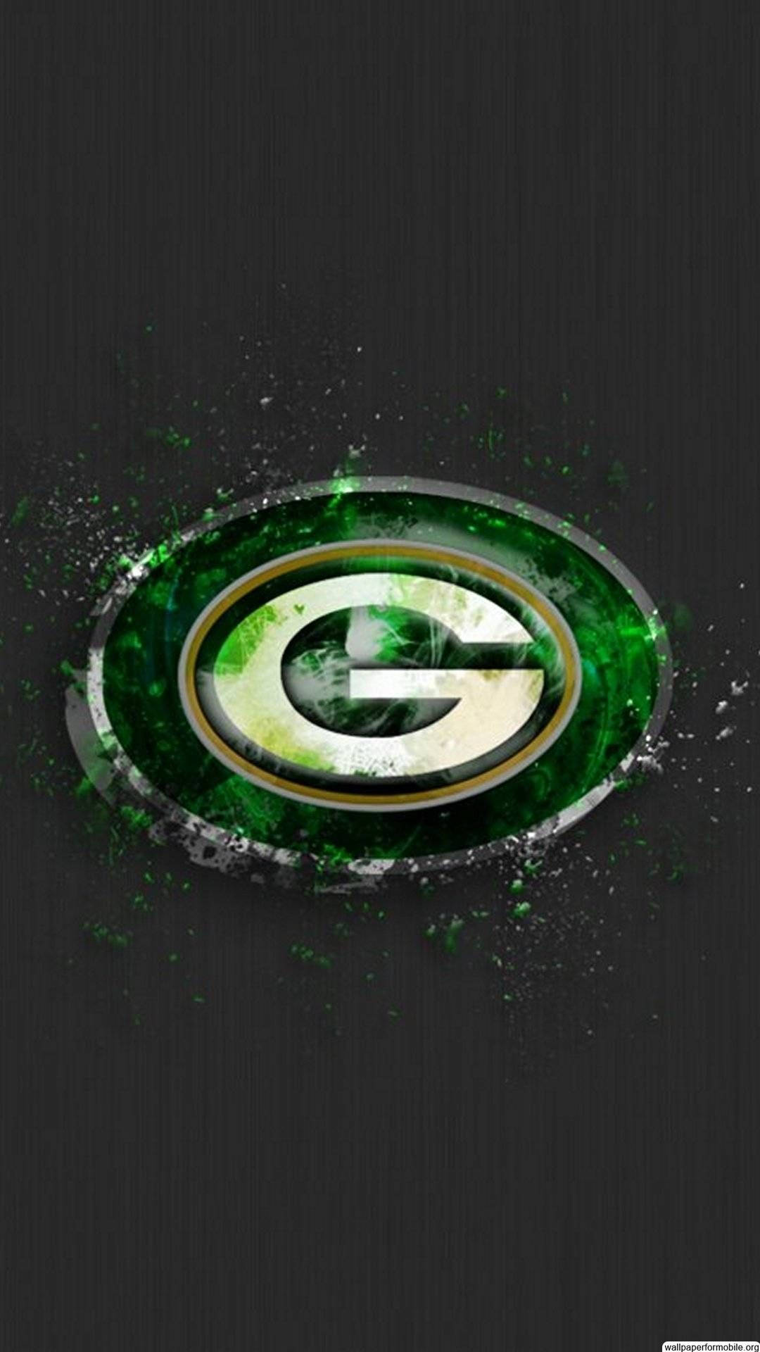Packers 桌布 壁紙 — 充滿活力的綠色和金色綠灣包裝工標誌在深色紋理背景上動態飛濺。