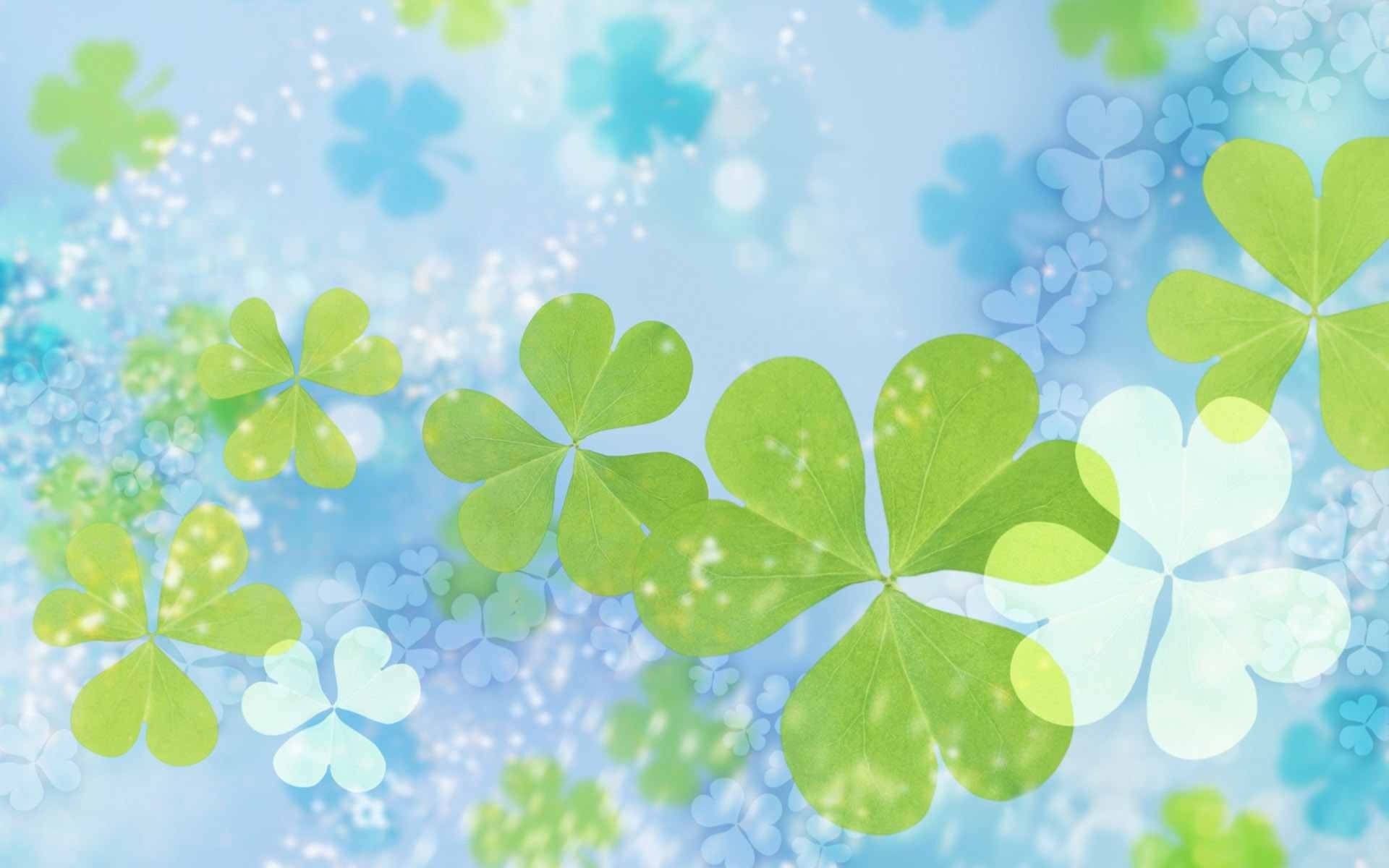 St Patrick's Day 桌布 壁紙 — 充滿活力的綠色四葉草在柔和的藍色背景上優雅地漂浮，帶有閃爍的光效。