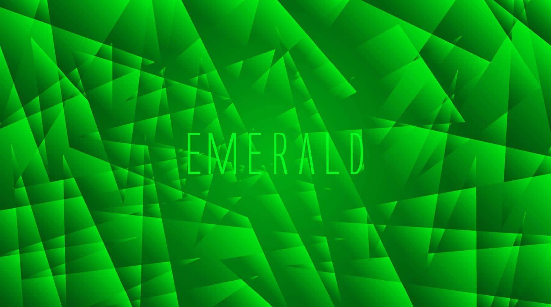 Emerald 桌布 壁紙 — 充滿活力的綠色幾何碎片形成動態抽象背景，中心閃耀著 emerald 一詞。