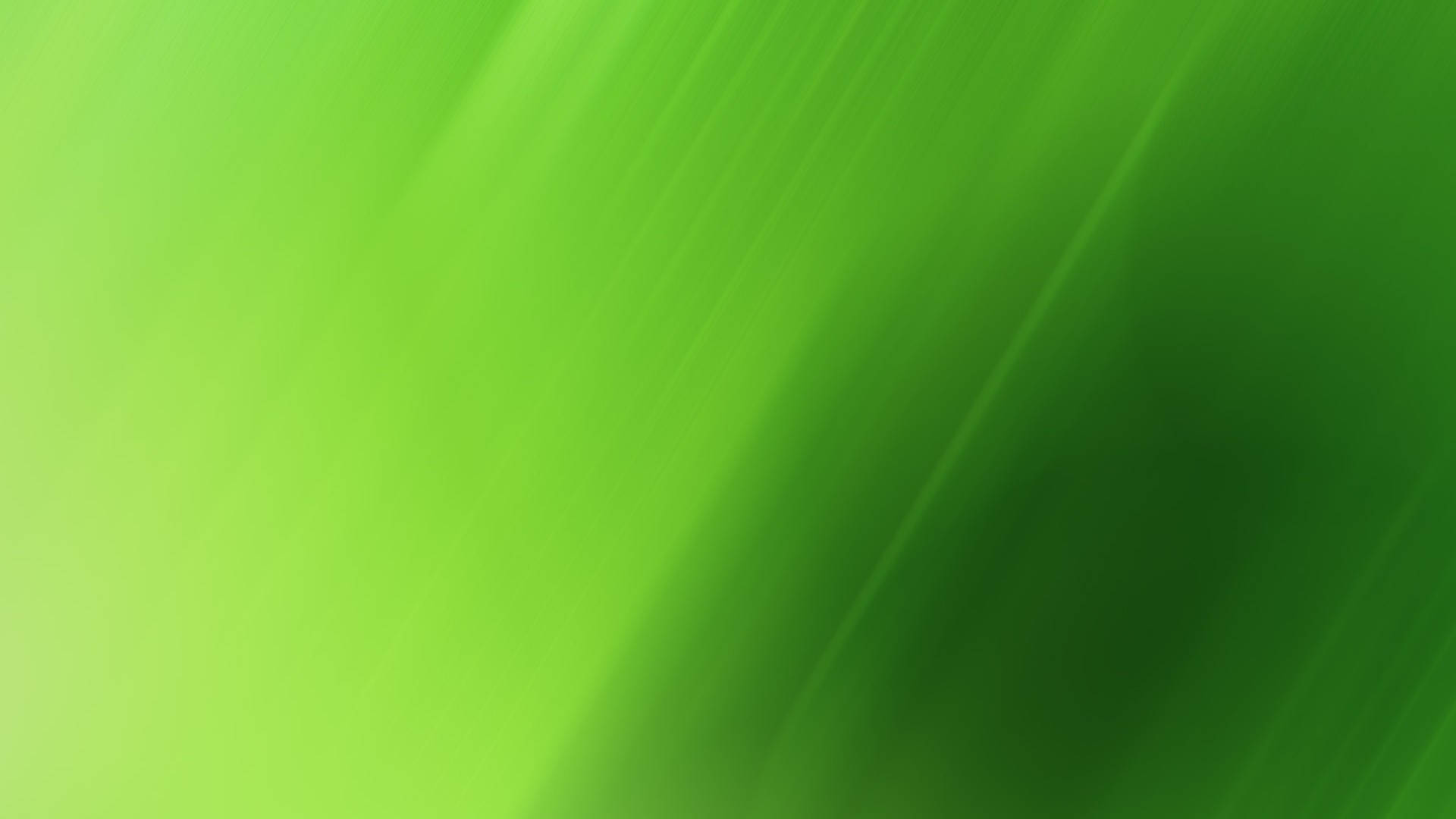 漸層 桌布 壁紙 — 充滿活力的綠色漸變，帶有對角光線條紋，營造出動態抽象背景。