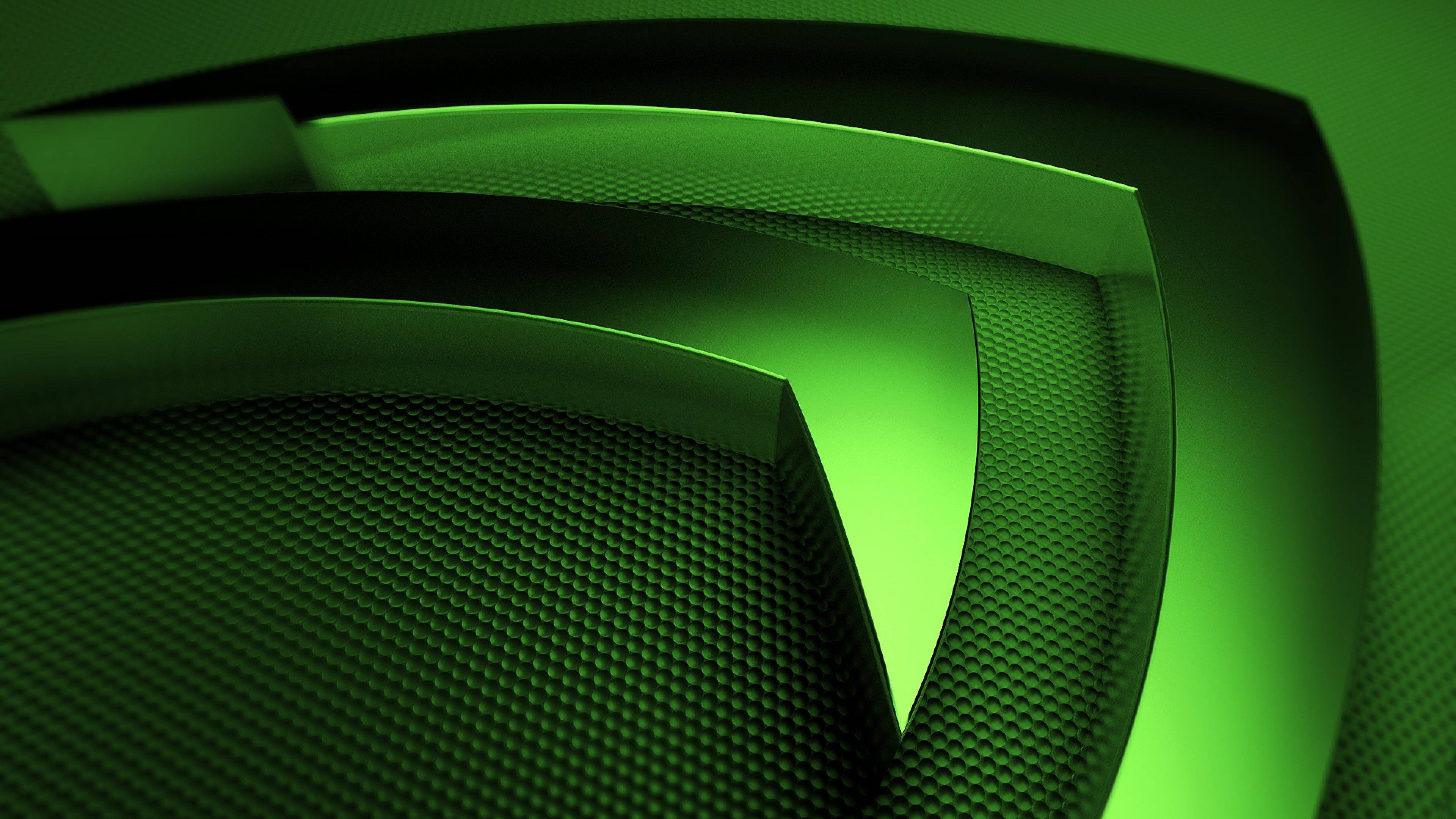 nvidia 桌布 壁紙 — 充滿活力的綠色發光幾何層與紋理碳纖維表面創造出未來主義的抽象構圖。