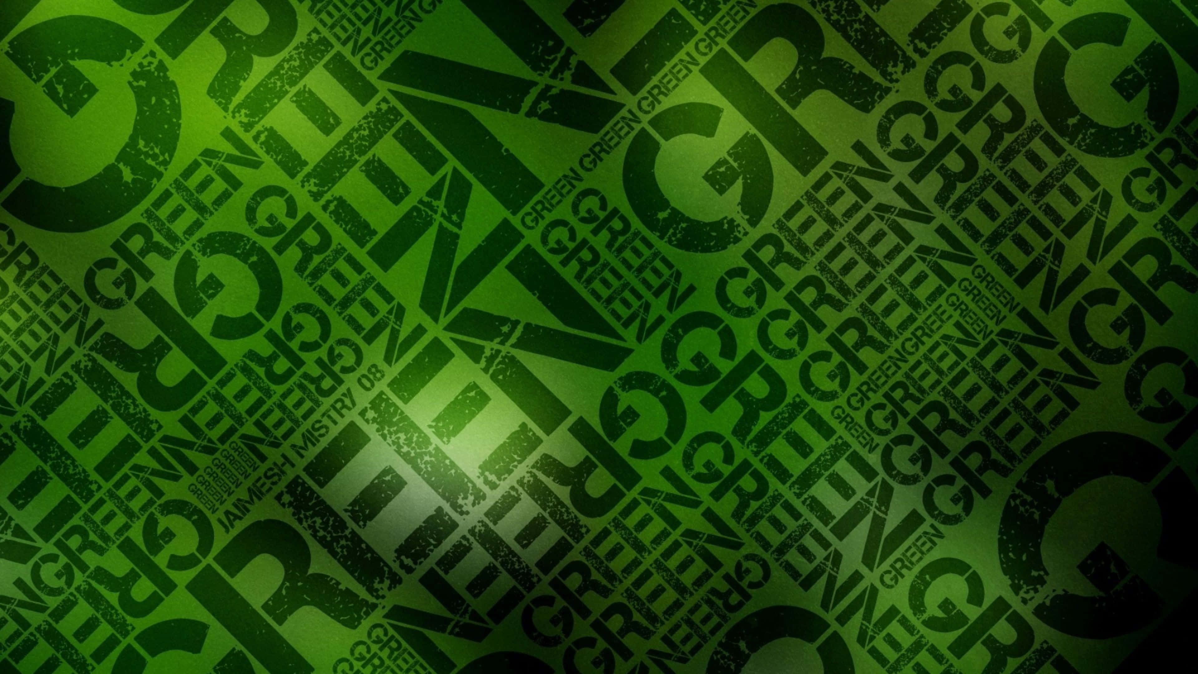 桌布 壁紙 — 充滿活力的綠色紋理壁紙，帶有重複的磨損 'GREEN' 文字，以粗體對角線層呈現。