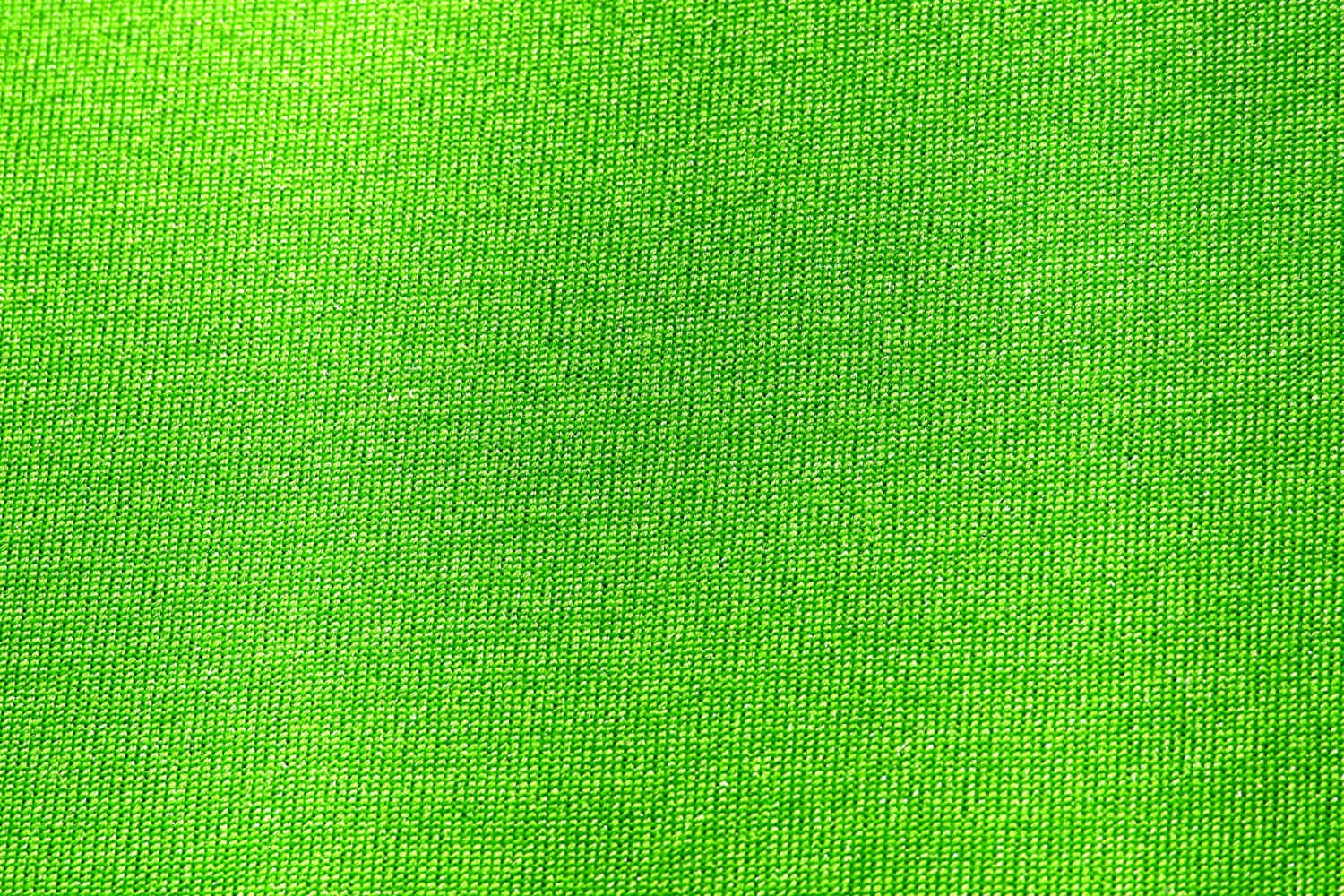 Fabric 桌布 壁紙 — 充滿活力的綠色紋理布料，其編織表面帶有微妙的漸變照明。