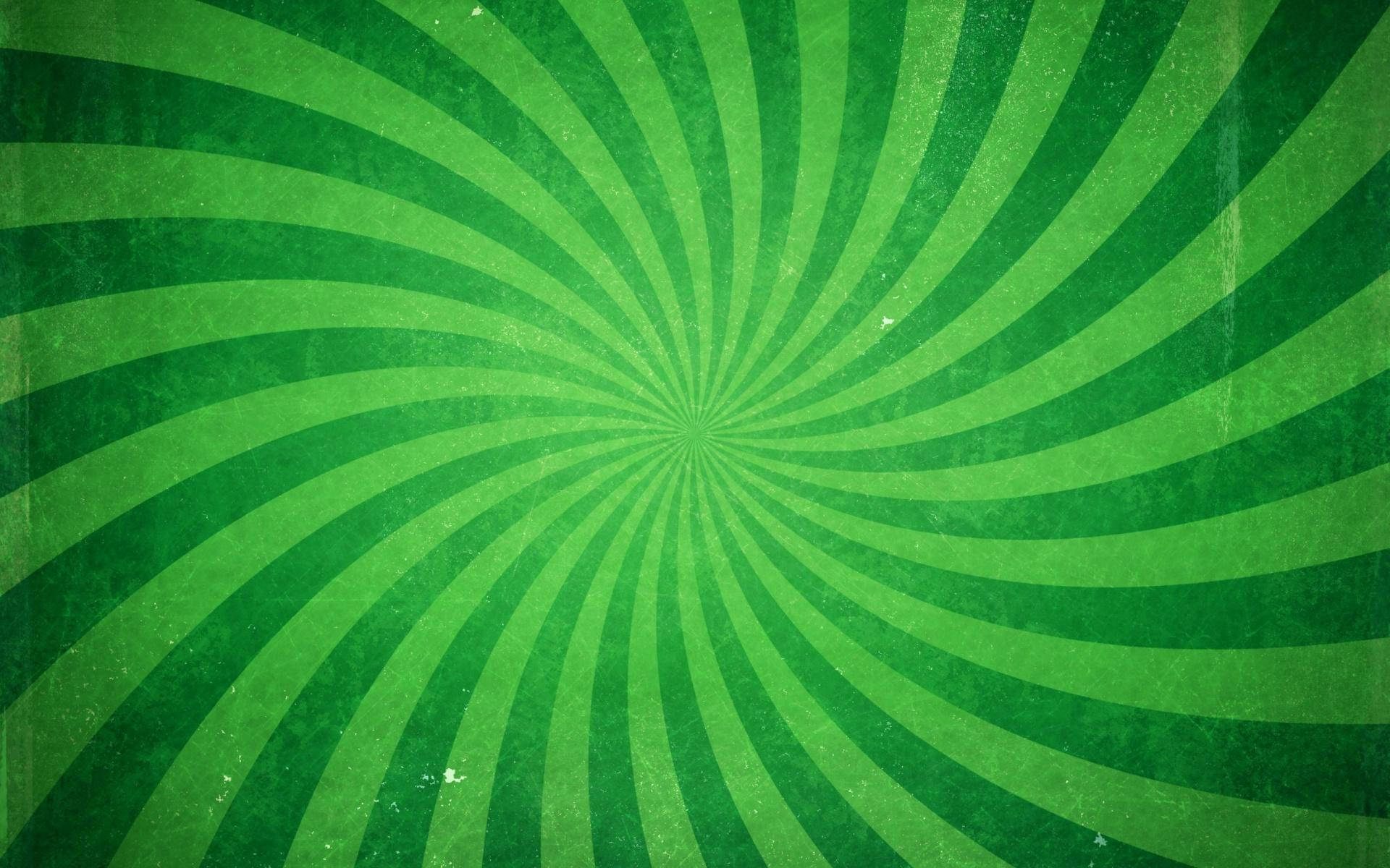 Spiral 桌布 壁紙 — 充滿活力的綠色螺旋條紋從中心點向外輻射，位於有紋理的復古背景上。