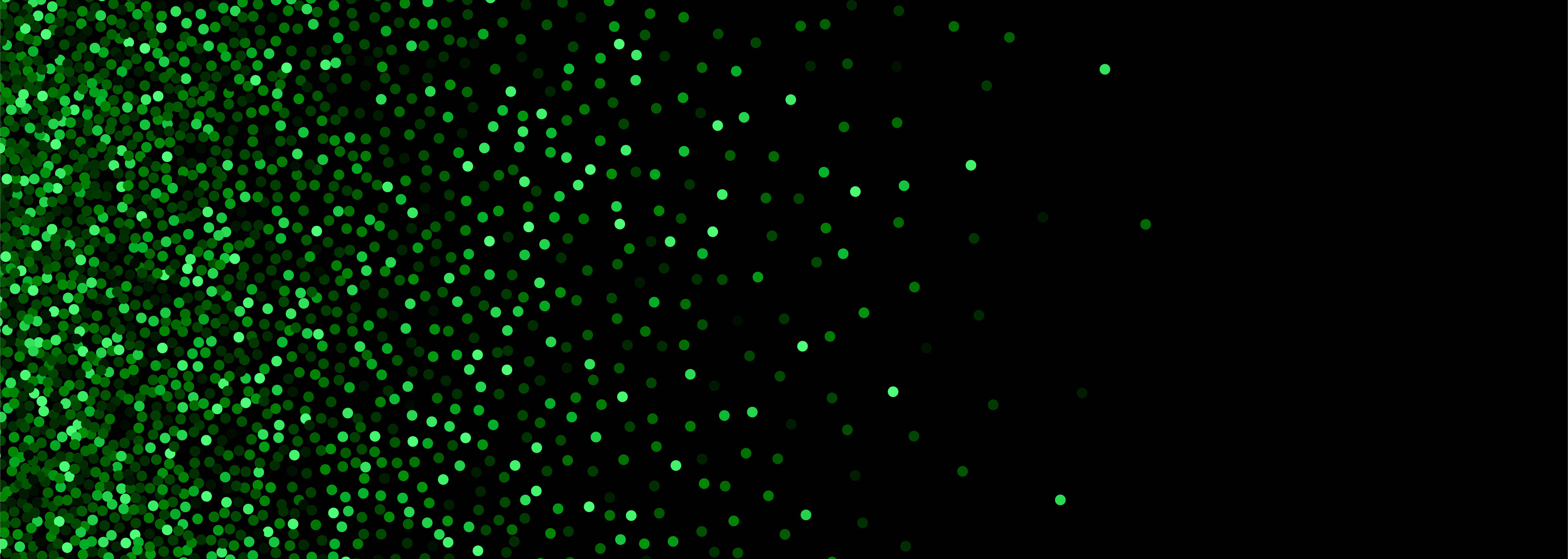 Green Glitter 桌布 壁紙 — 充滿活力的綠色閃粉顆粒在純黑色背景上對角線傾瀉而下，營造出閃閃發光的節日效果。