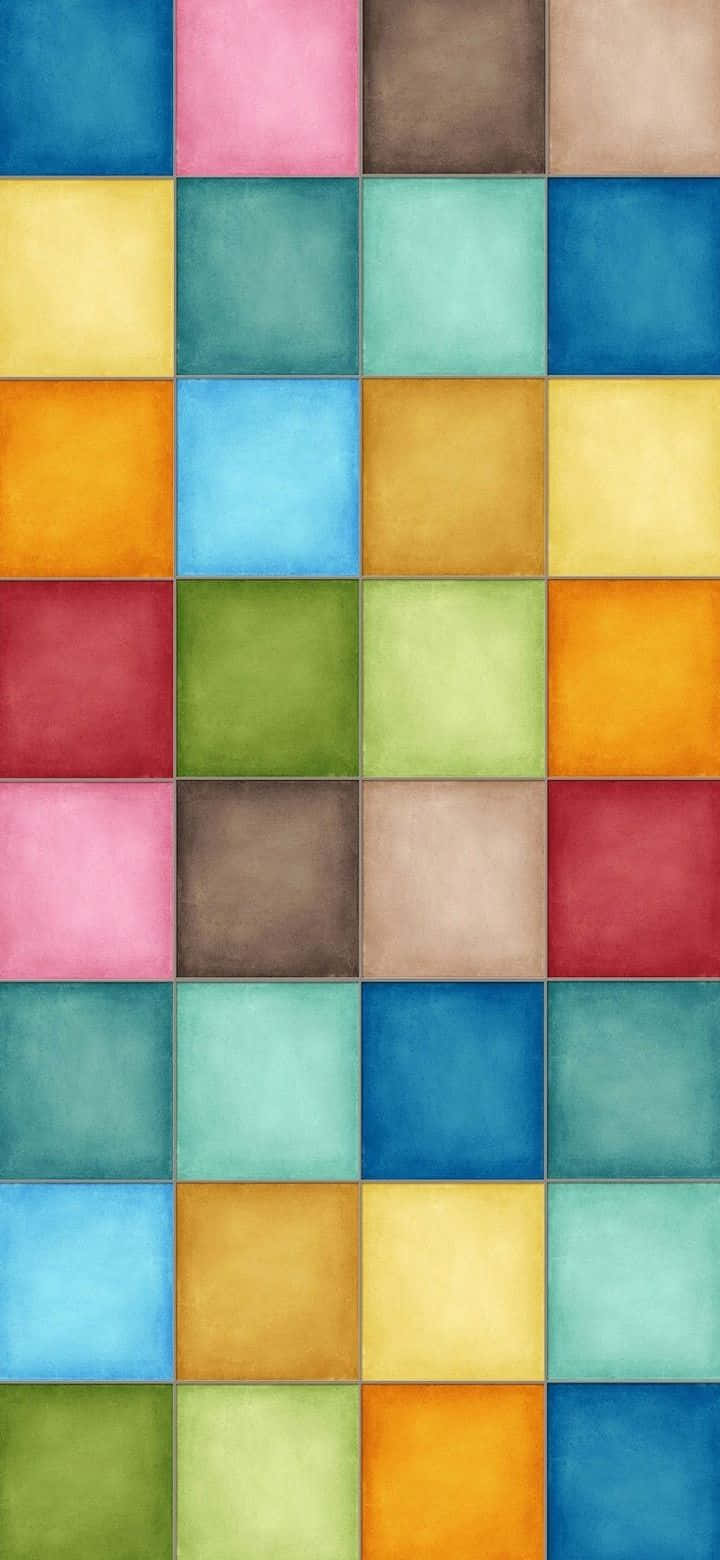 Color Block 桌布 壁紙 — 充滿活力的網格，由帶紋理的彩色方塊組成，以粉彩和飽和色調排列成重複圖案。