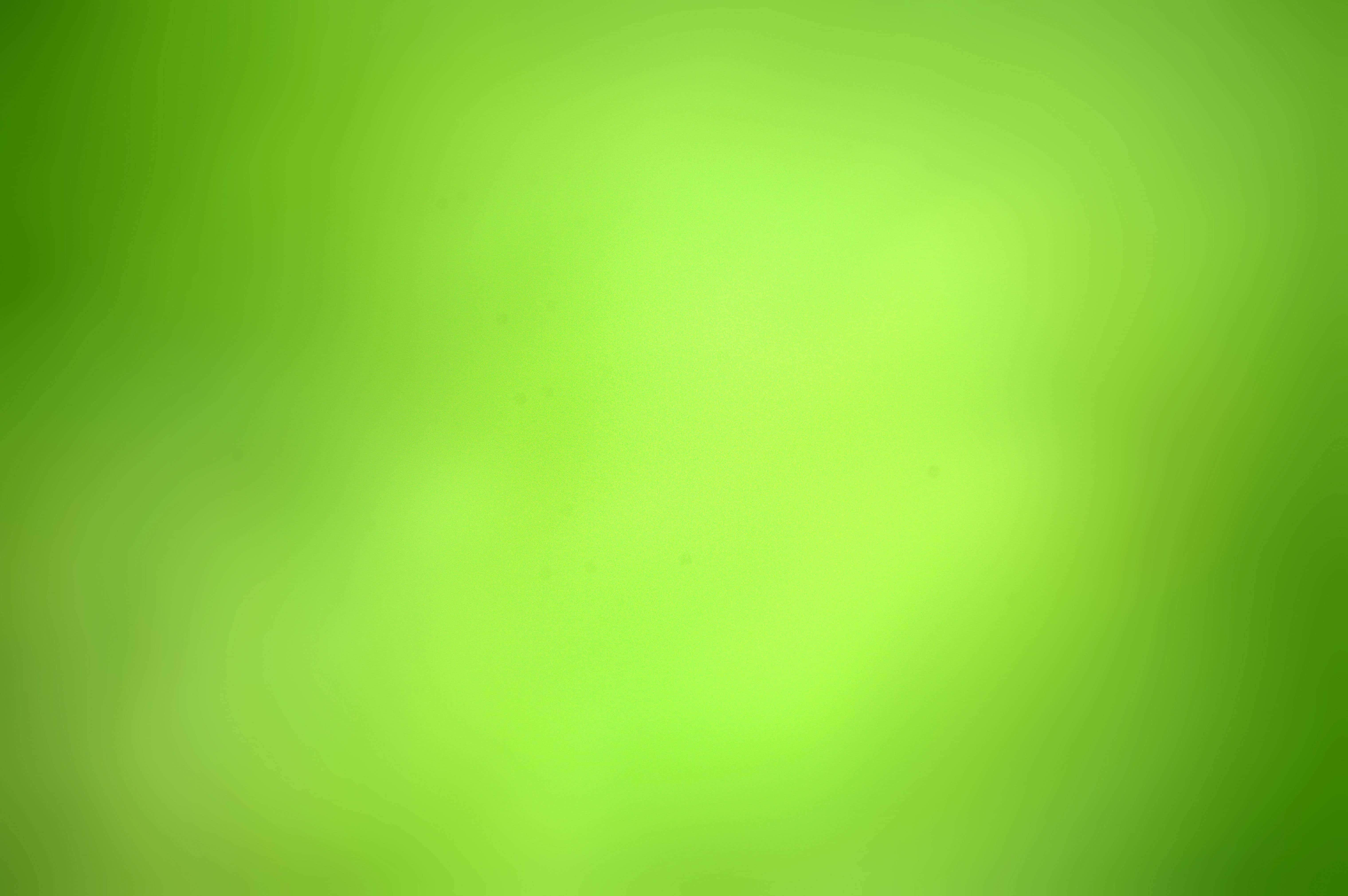 綠色 桌布 壁紙 — 充滿活力的萊姆綠色柔和漸變，帶有細微紋理和柔和的光線變化。