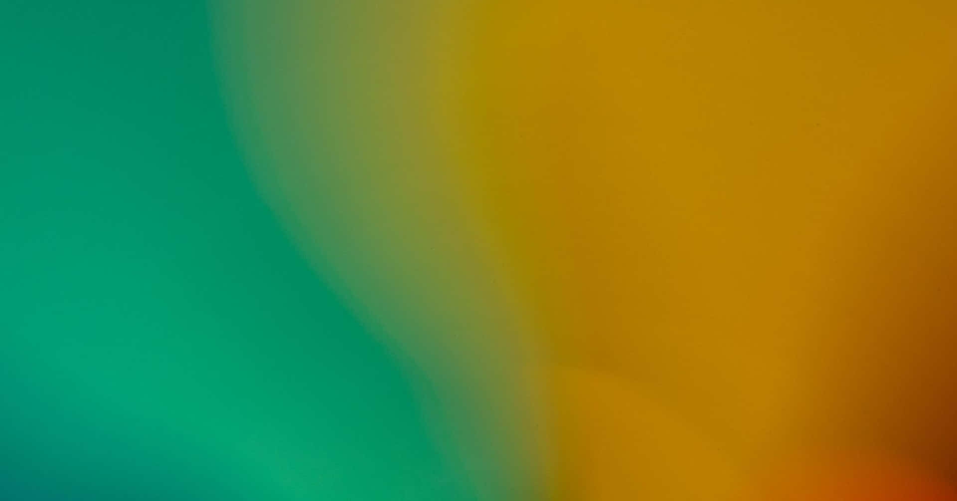 Yellow Gradient 桌布 壁紙 — 充滿活力的藍綠色和金色黃色漸變在平滑的抽象流動中柔和地融合。