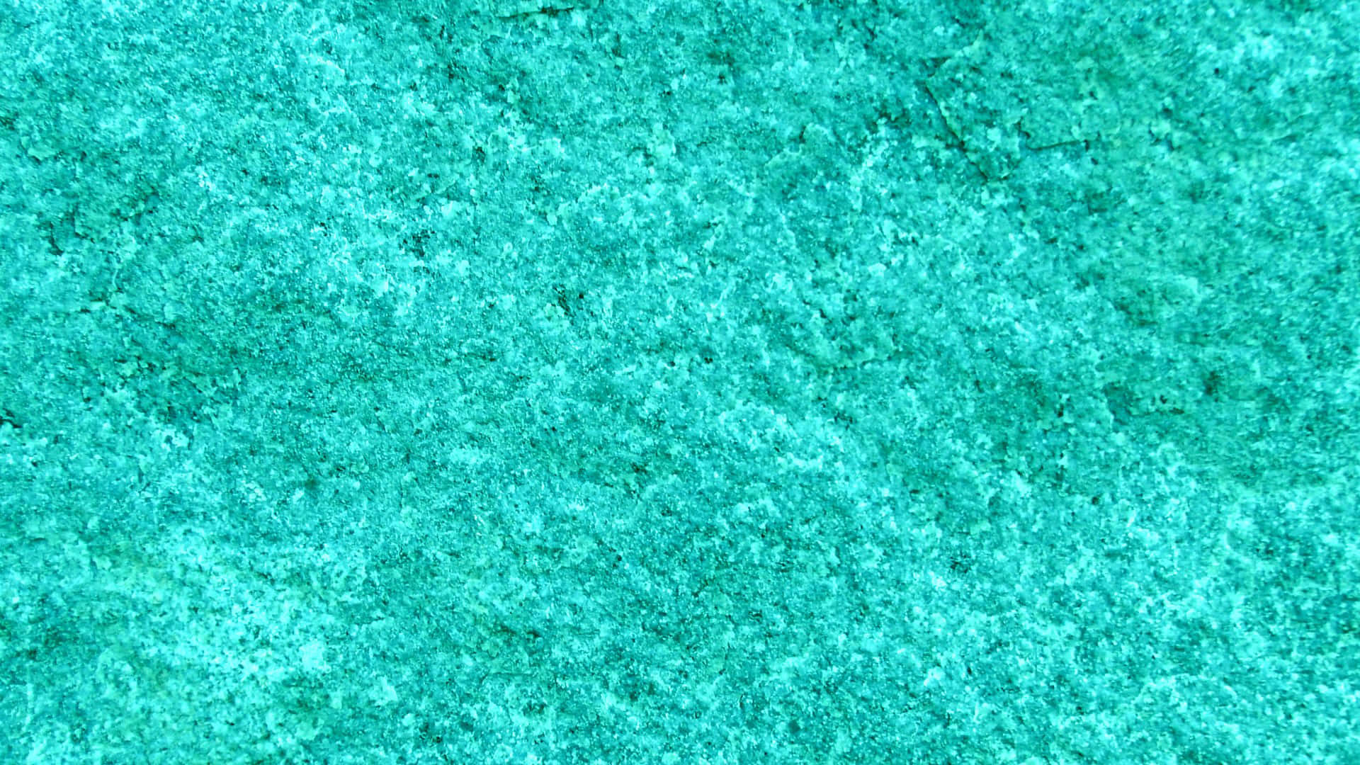 Turquoise Blue 桌布 壁紙 — 充滿活力的藍綠色紋理表面的特寫，帶有細微的顆粒和斑點。