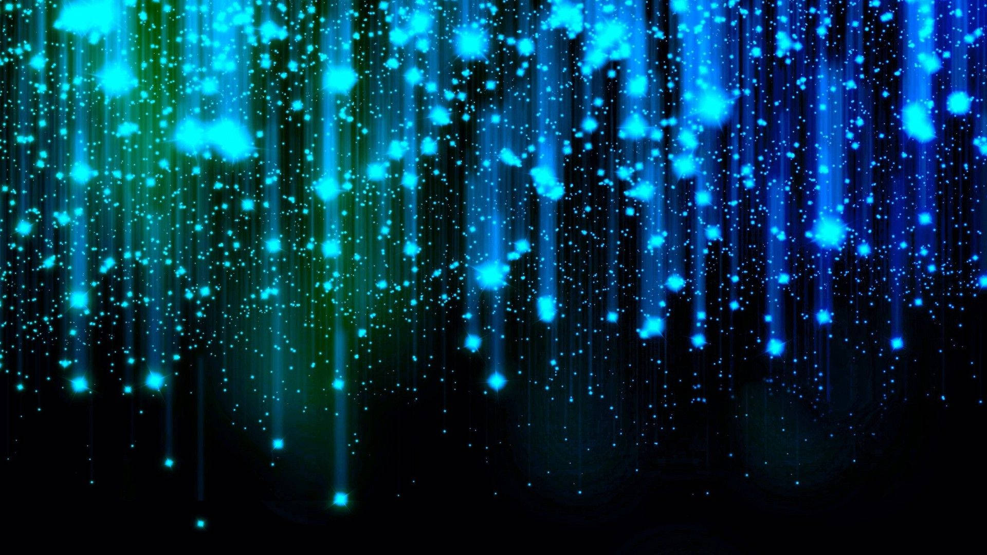Stars 桌布 壁紙 — 充滿活力的藍色和綠色發光粒子像數位雨一樣在深黑色背景上傾瀉而下。