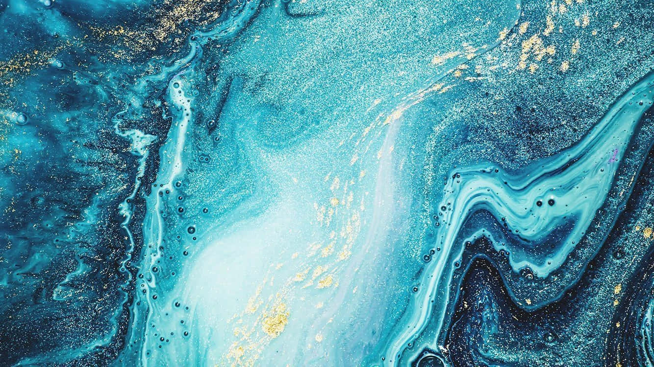 青色GIF 桌布 壁紙 — 充滿活力的藍色和金色抽象流體藝術，帶有漩渦圖案和閃爍斑點。
