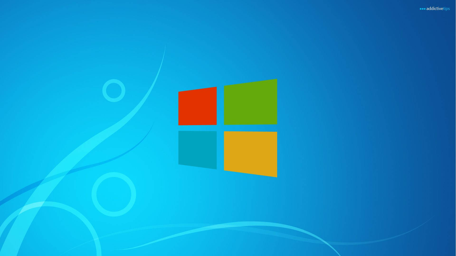 Windows 桌布 壁紙 — 充滿活力的藍色壁紙，帶有標誌性的Windows標誌、旋轉的光線圖案和漸變陰影。