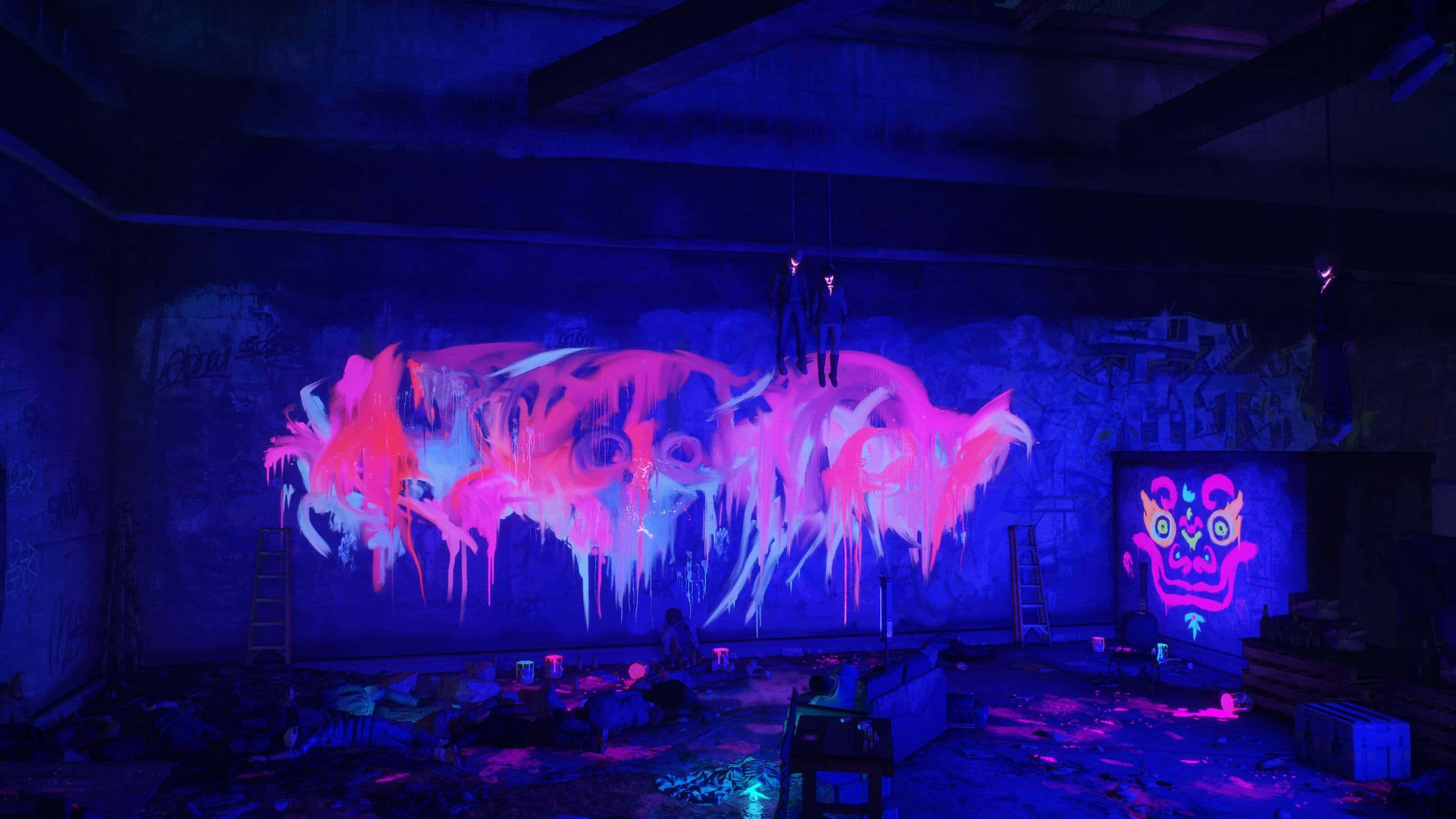 Epic Neon 桌布 壁紙 — 充滿活力的螢光粉紅和藍色塗鴉藝術在昏暗燈光下滴落在黑暗廢棄倉庫牆上。