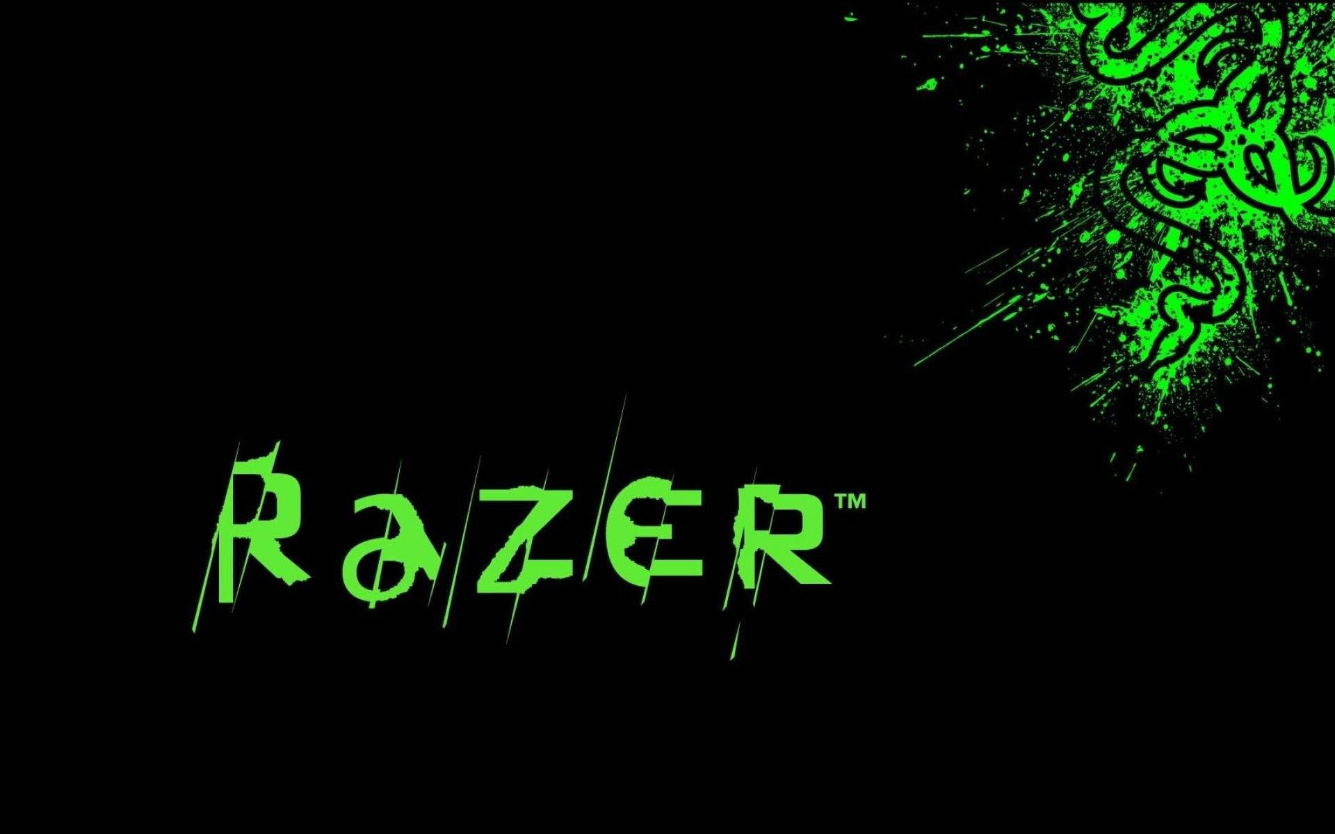 雷蛇 桌布 壁紙 — 充滿活力的螢光綠色Razer標誌和風格化的蛇形徽章在純黑色背景上迸發而出。