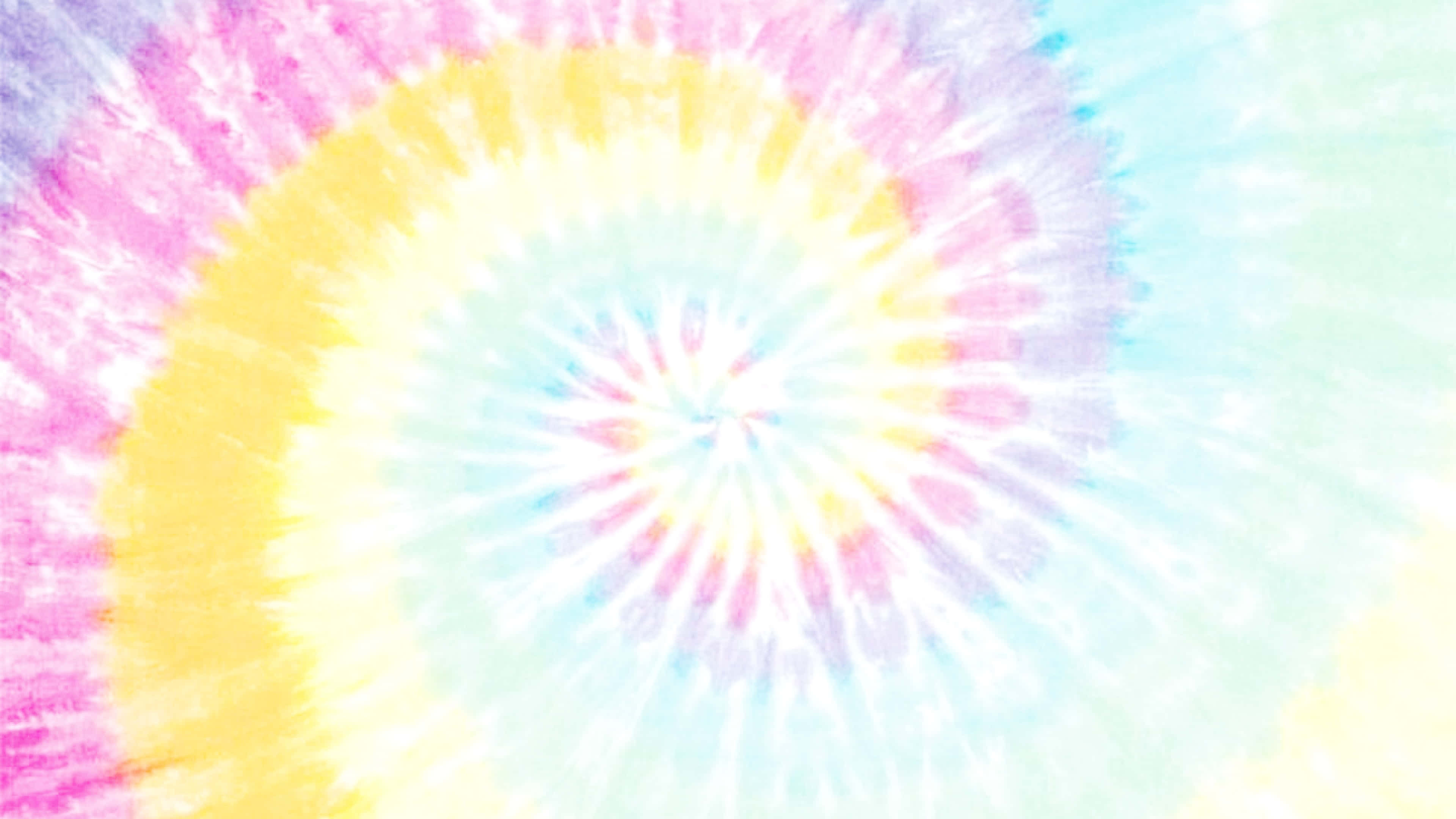 Pastel Tie Dye 桌布 壁紙 — 充滿活力的螺旋紮染圖案從中心向外輻射，帶有粉彩粉紅、黃、藍和白色，呈現柔軟紋理漩渦。