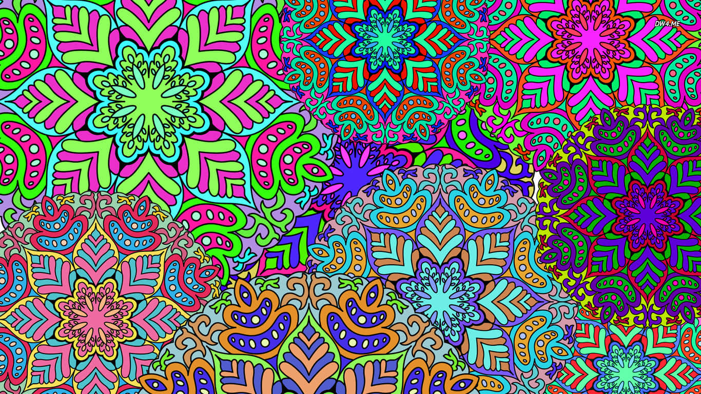 色彩繽紛的抽象圖案，帶有重複的花卉和幾何形狀。 — 曼陀羅 GIF 壁紙