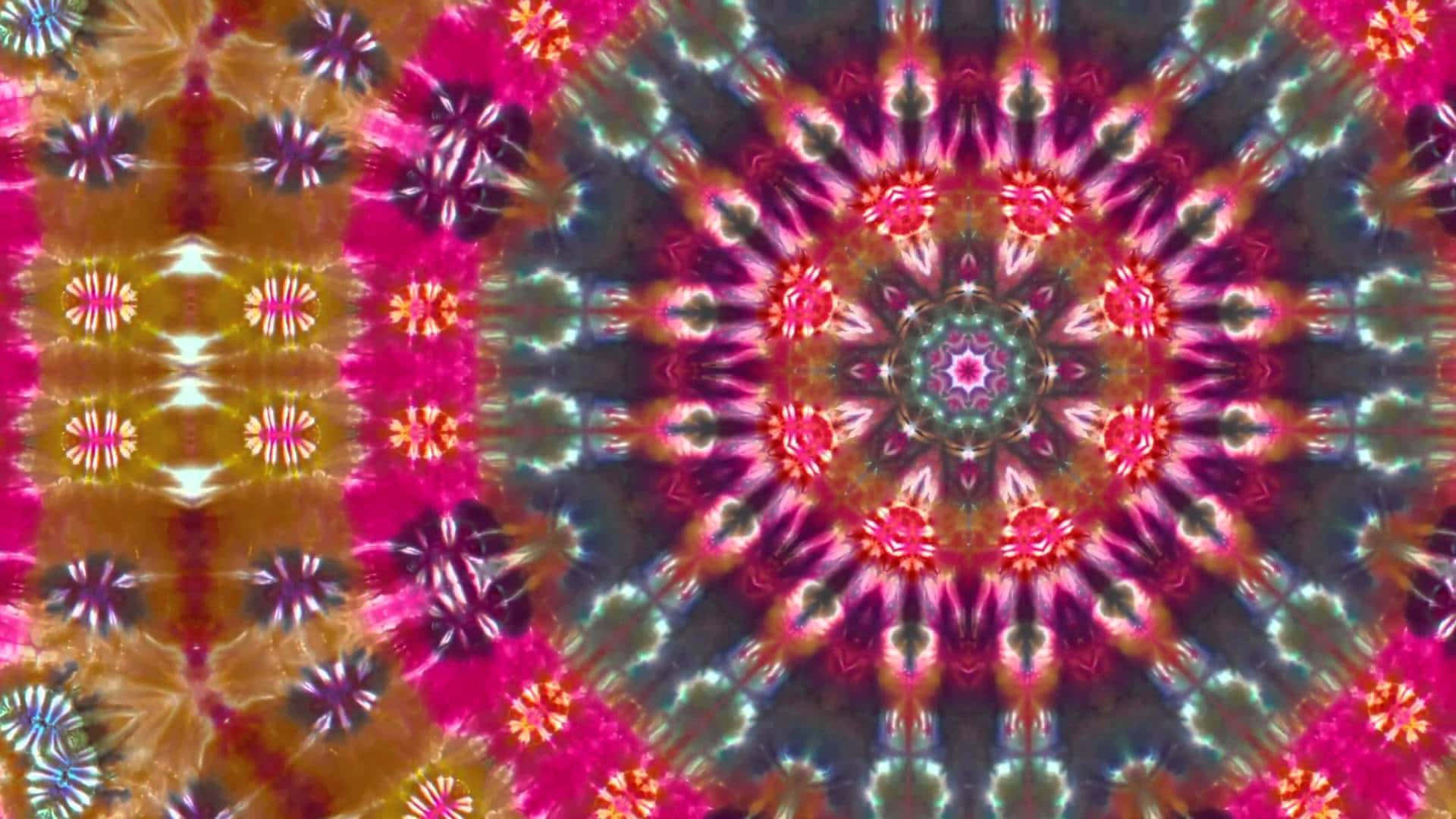 扎染 桌布 壁紙 — 充滿活力的迷幻曼陀羅，帶有對稱的花卉圖案，從中心核心以鮮豔的粉紅色、金色和藍綠色輻射出來。
