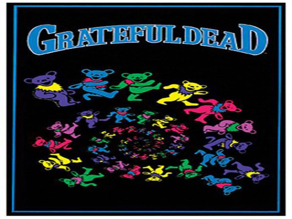 dead 桌布 壁紙 — 充滿活力的迷幻熊在彩虹色調中，於黑色背景上在「Grateful Dead」文字下旋轉跳舞。