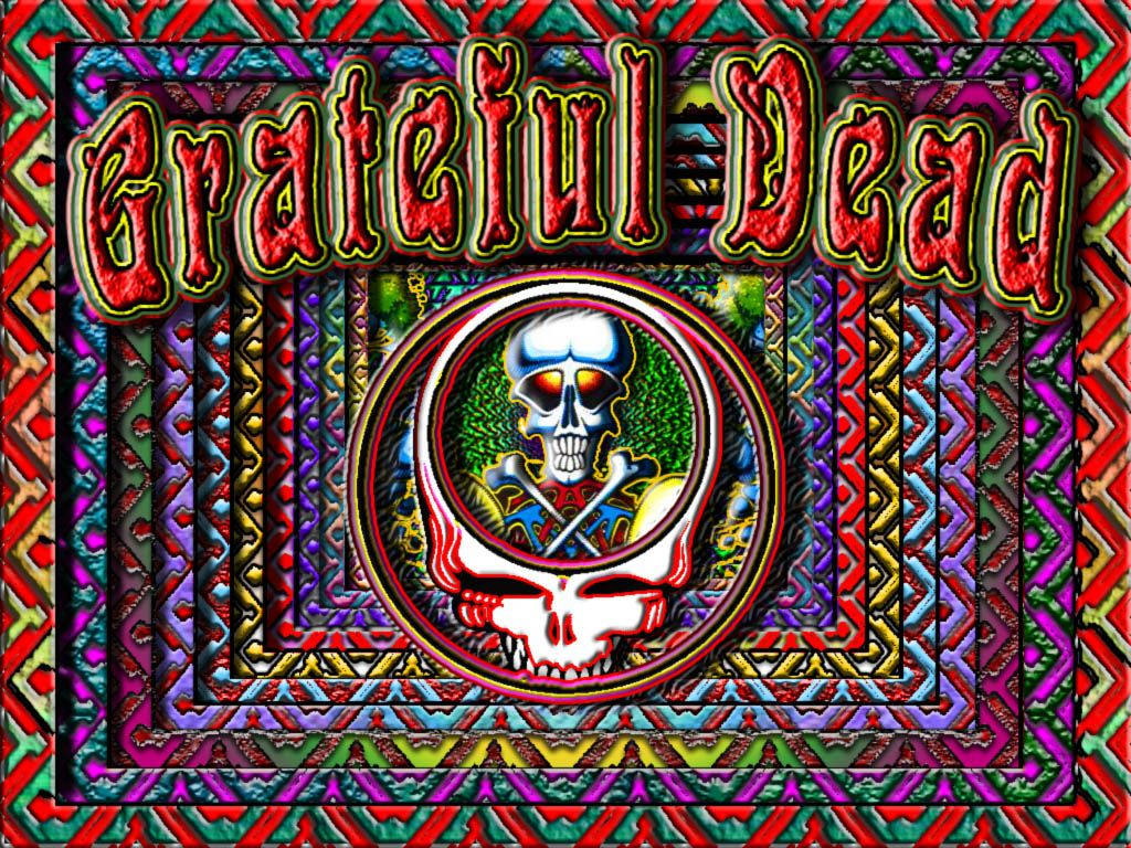 dead 桌布 壁紙 — 充滿活力的迷幻藝術作品，以 Grateful Dead 標誌為特色，骷髏頭和交叉骨頭周圍環繞著複雜多彩的圖案。
