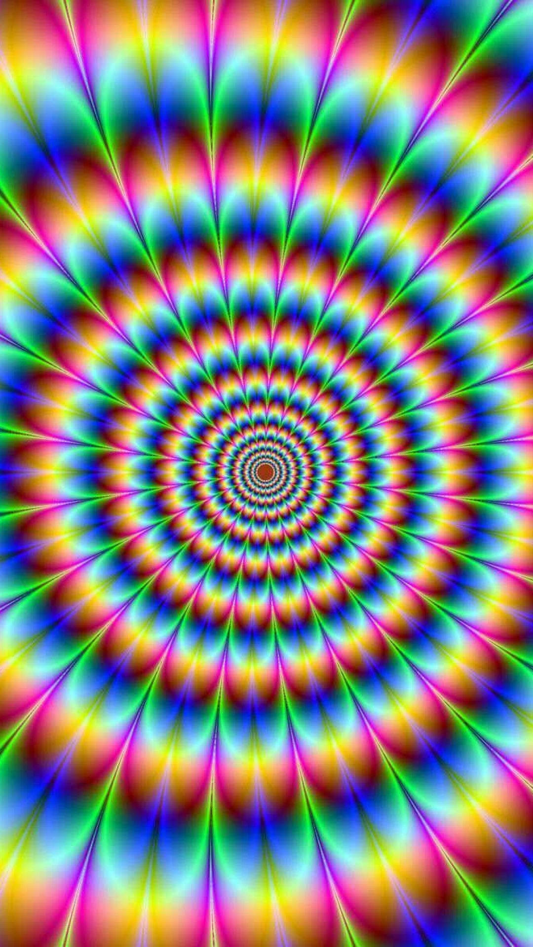 Hippie Aesthetic 桌布 壁紙 — 充滿活力的迷幻螺旋以催眠般的彩虹色向外輻射，創造出迷人的視錯覺。
