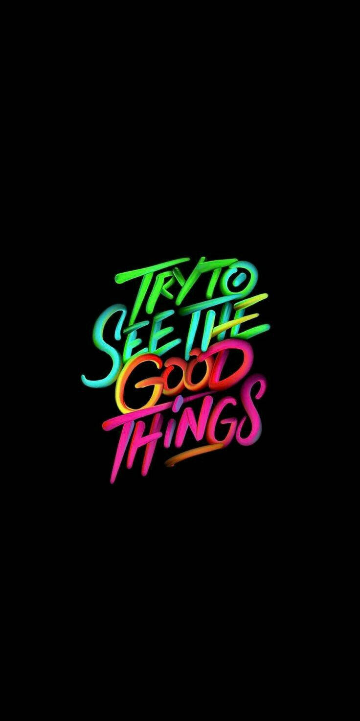 Positive Quotes 桌布 壁紙 — 充滿活力的霓虹漸變文字「嘗試看到美好的事物」在純黑色背景上發光。
