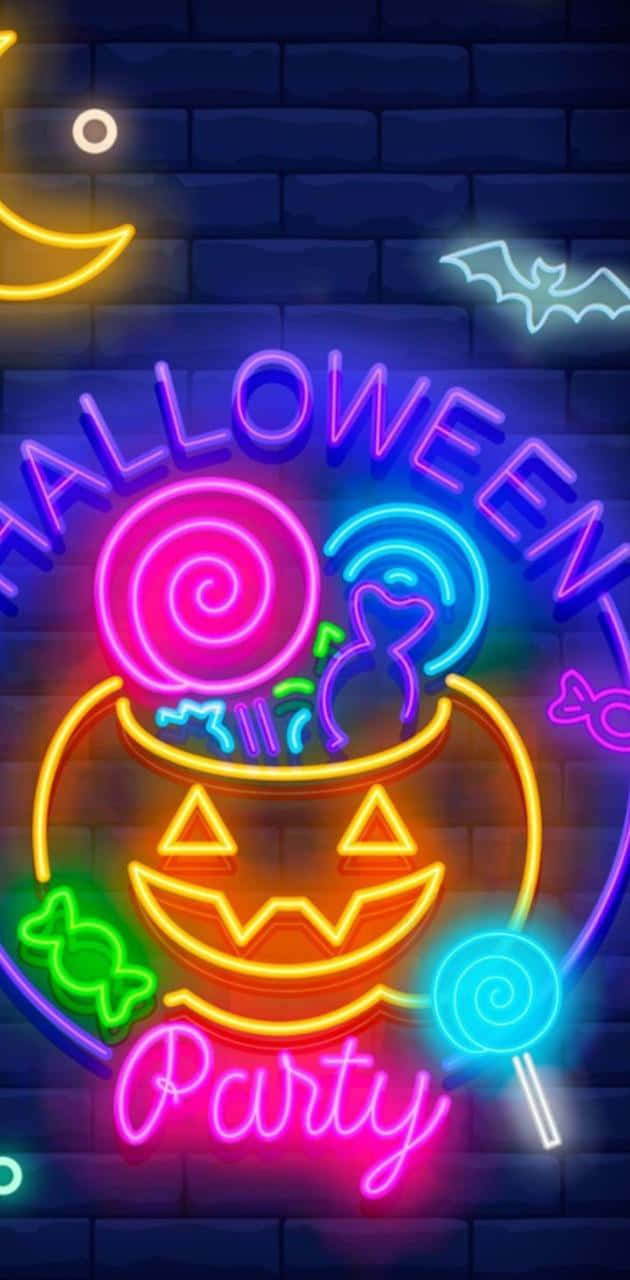 Neon Halloween 桌布 壁紙 — 充滿活力的霓虹燈萬聖節派對標誌在黑暗的磚牆上發光，裝飾有蝙蝠和糖果。