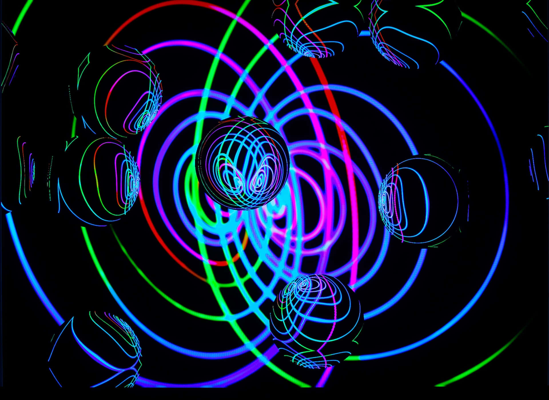 Psychedelic Neon Lights 桌布 壁紙 — 充滿活力的霓虹球體和旋轉的線條在黑色虛空中發光，形成迷人的數位隧道。
