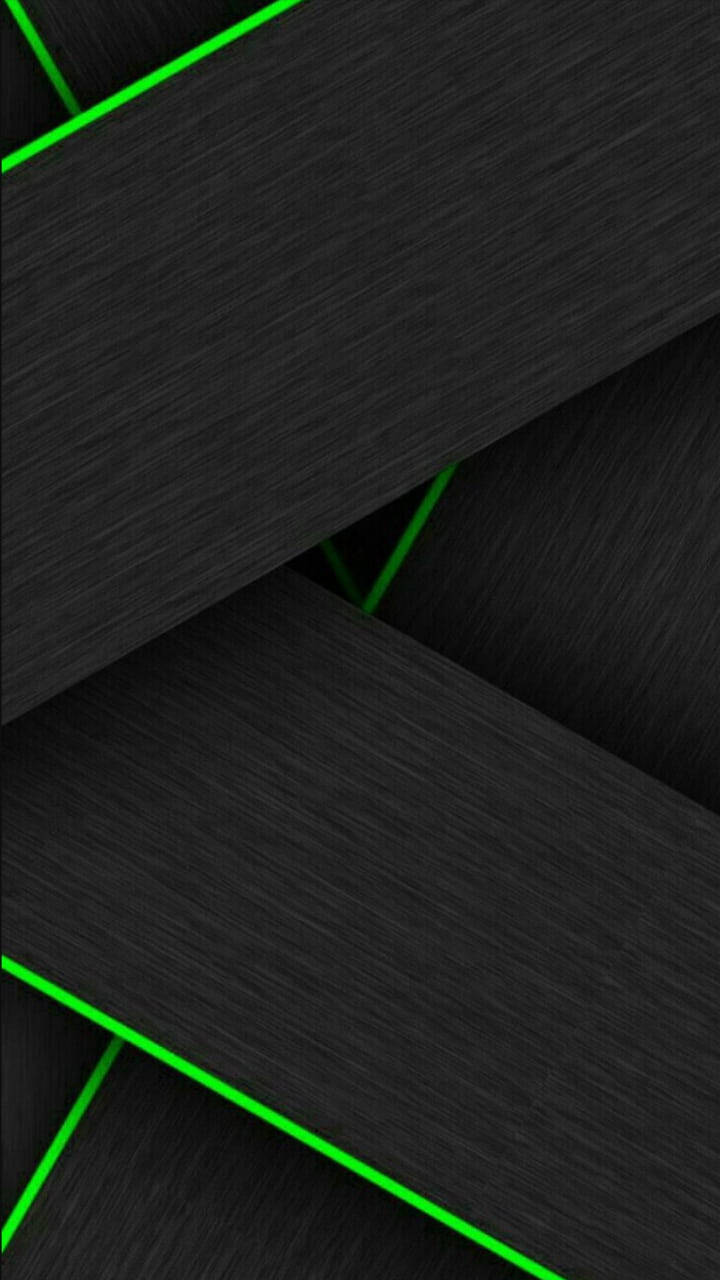 Black And Green 桌布 壁紙 — 充滿活力的霓虹綠色雷射線條穿過帶紋理的黑色面板，形成大膽的幾何圖案。