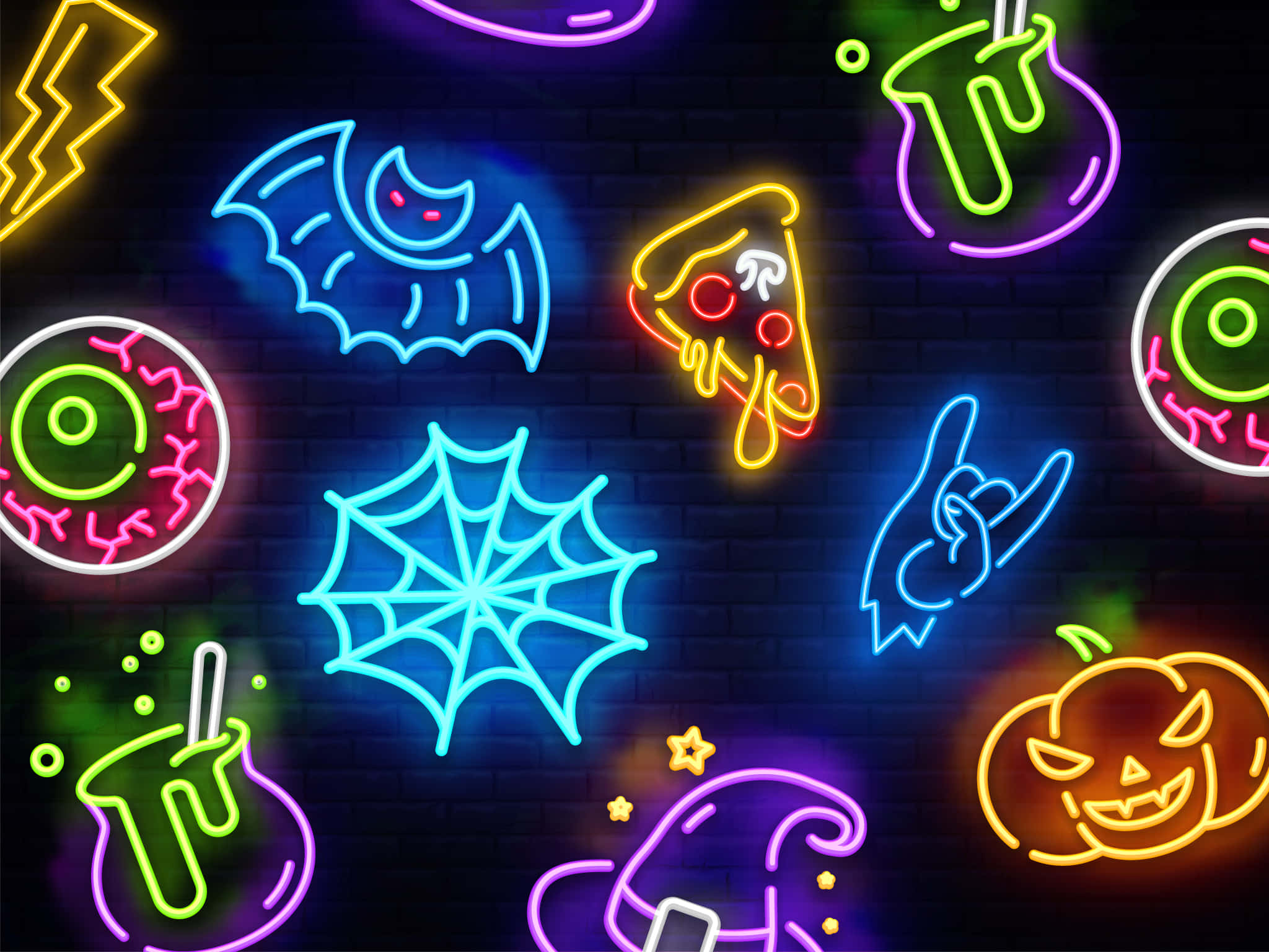 Neon Halloween 桌布 壁紙 — 充滿活力的霓虹萬聖節符號在深色磚牆上發光，營造出節日詭異的氣氛。