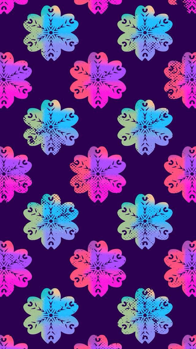 可愛女生 桌布 壁紙 — 充滿活力的霓虹雪花圖案在深紫色背景上發光，形成重複的數位設計。