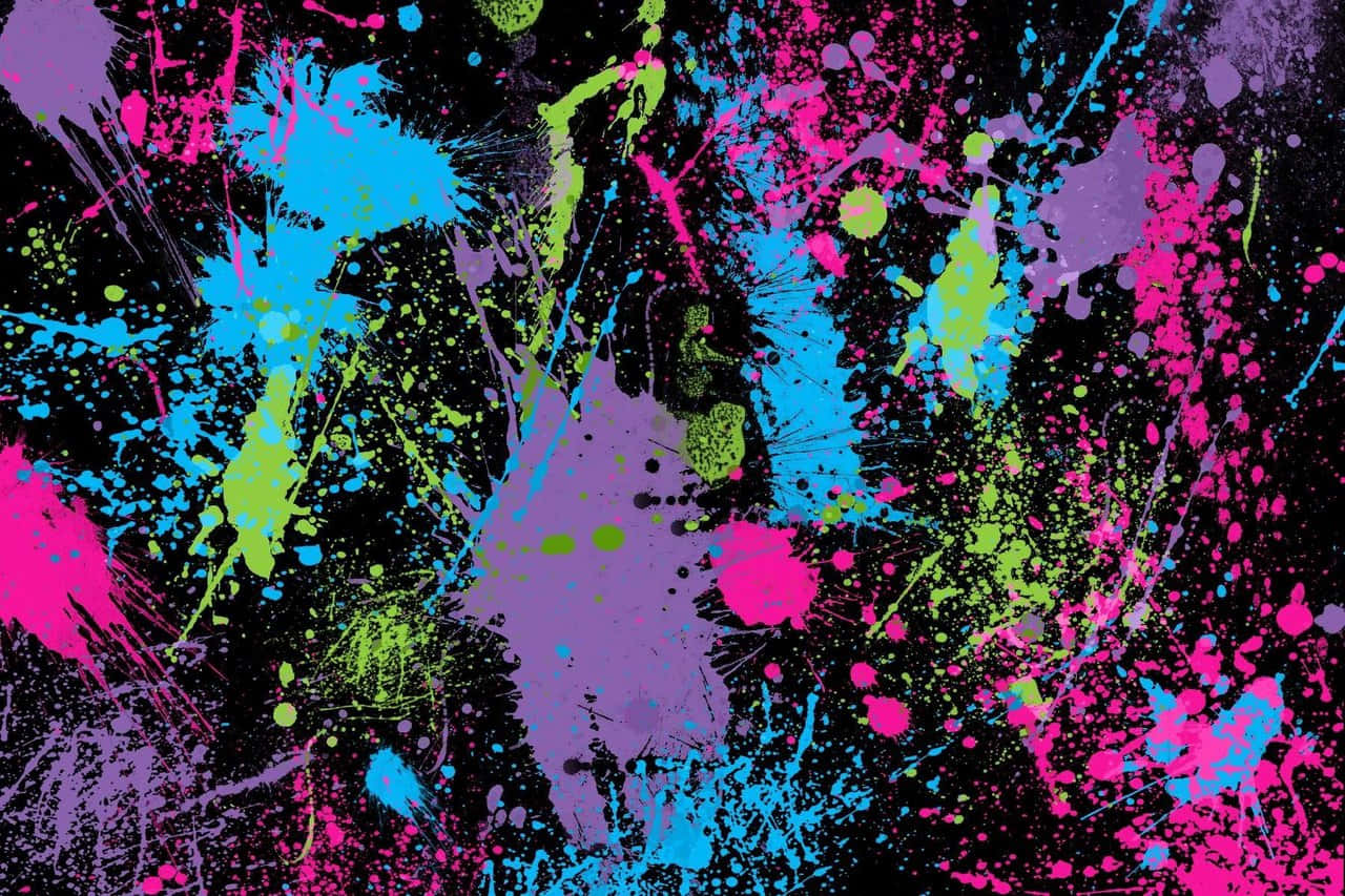 Splatter Paint 桌布 壁紙 — 充滿活力的霓虹顏料飛濺在黑色畫布上爆炸，形成混亂的色彩爆發。