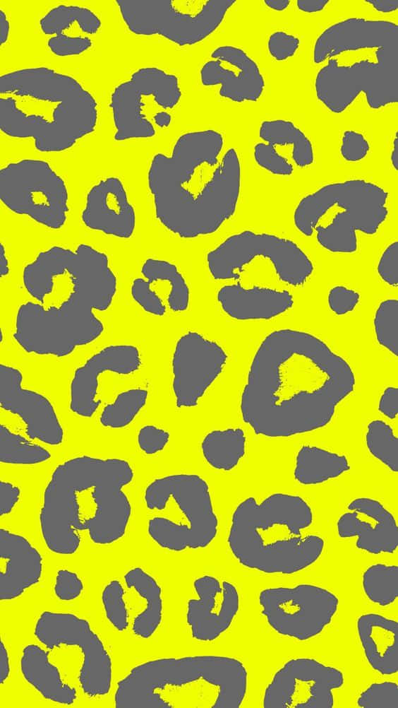 Animal Print 桌布 壁紙 — 充滿活力的霓虹黃色背景，帶有醒目的灰色豹紋斑點，形成重複圖案。
