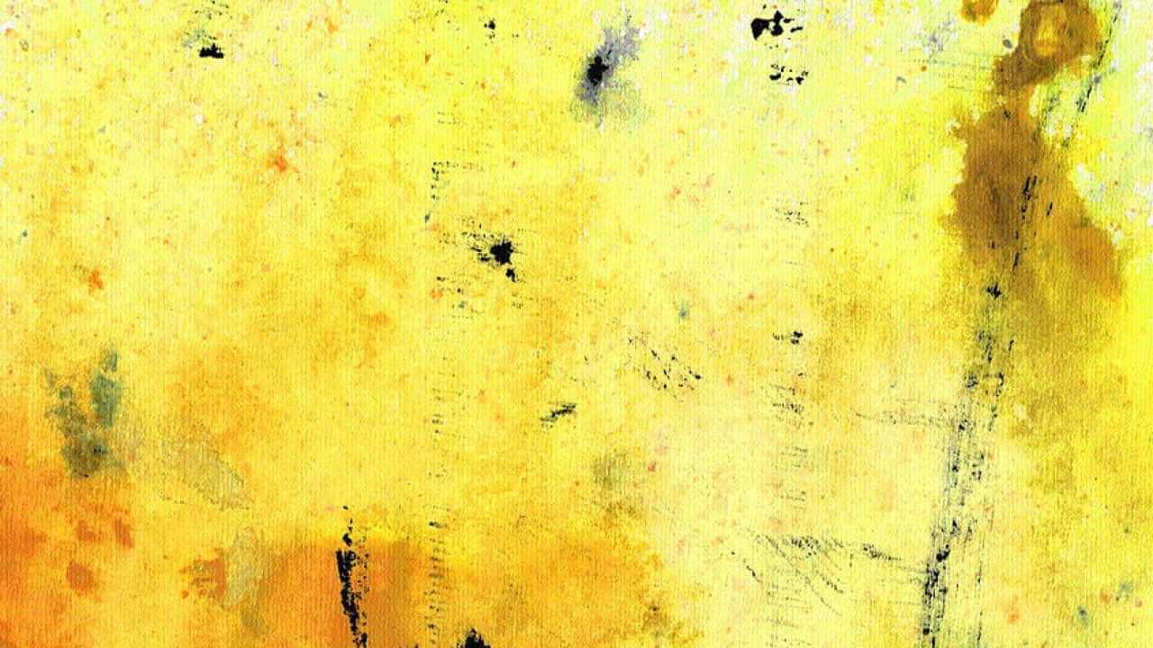 Yellow Abstract 桌布 壁紙 — 充滿活力的黃色紋理畫布，帶有飛濺和筆觸，營造出抽象藝術背景。