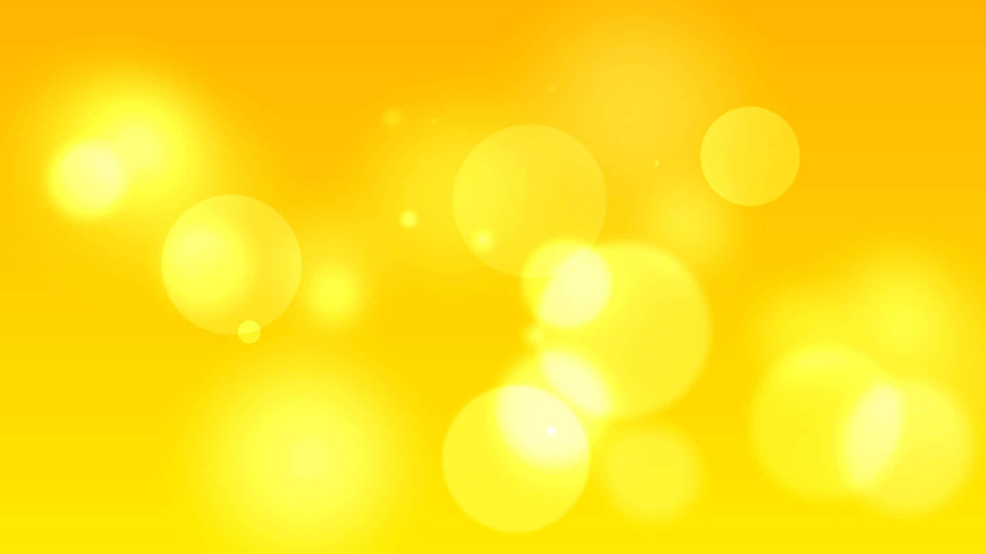 Yellow Abstract 桌布 壁紙 — 充滿活力的黃色背景，帶有柔和發光的散景圓圈，營造出溫暖夢幻的氛圍。