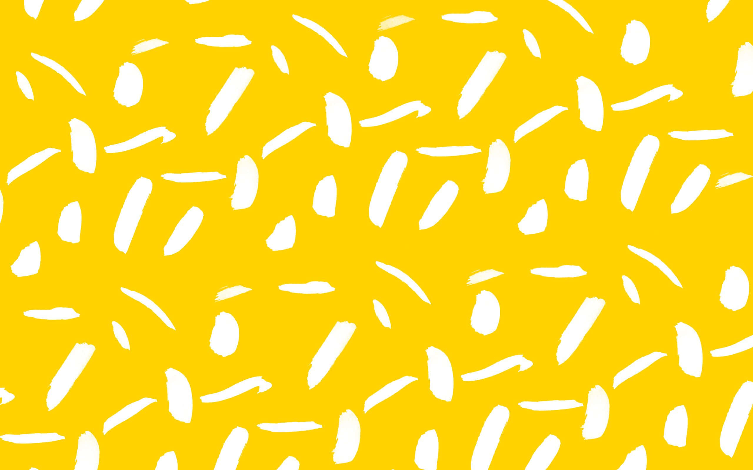 Yellow Pattern 桌布 壁紙 — 充滿活力的黃色背景，點綴著散落的白色筆觸，營造出俏皮的抽象圖案。