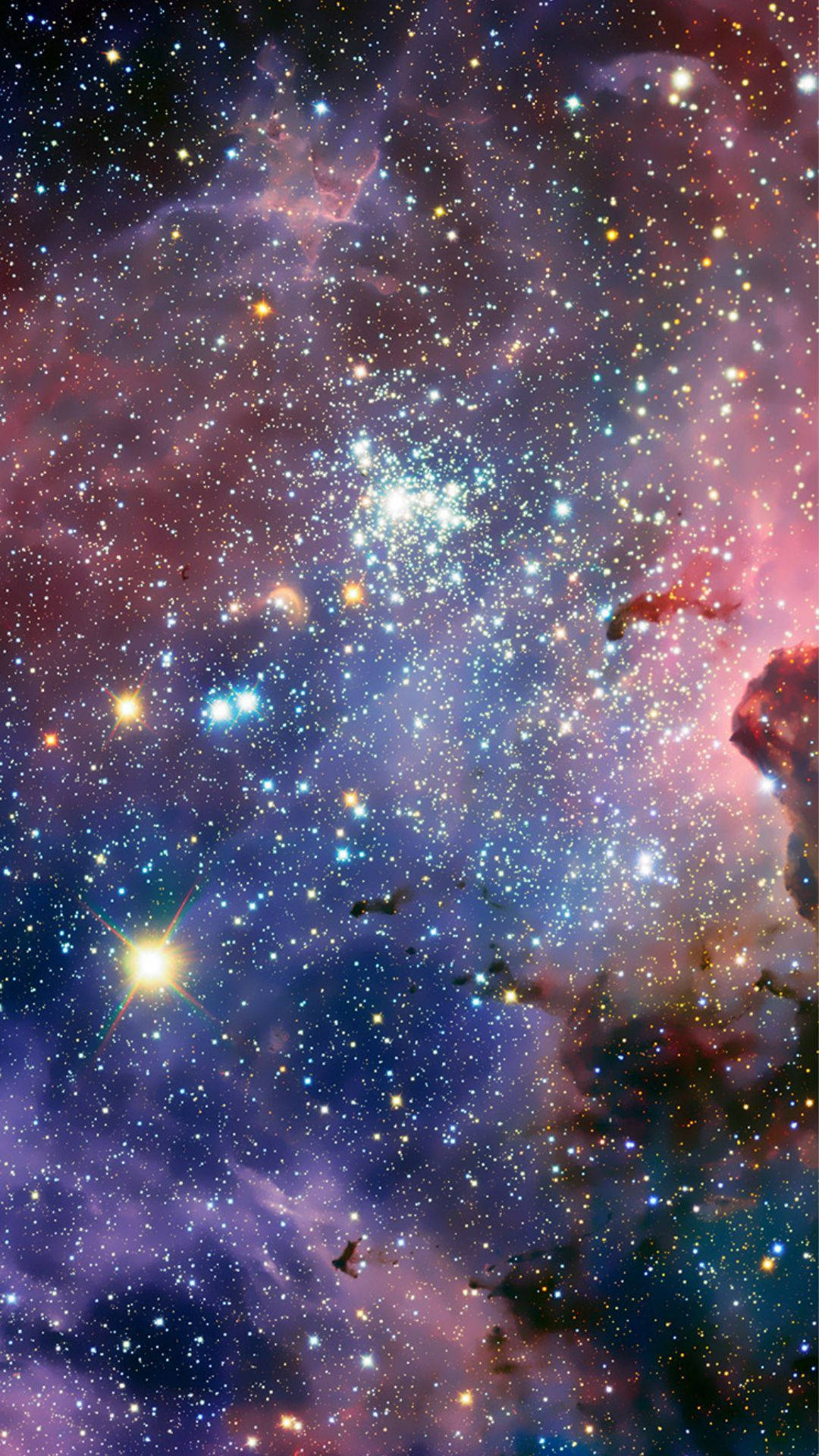 太空 iPhone 桌布 壁紙 — 充滿發光恆星和粉紅色、紫色、藍色氣體漩渦雲的充滿活力的宇宙星雲。