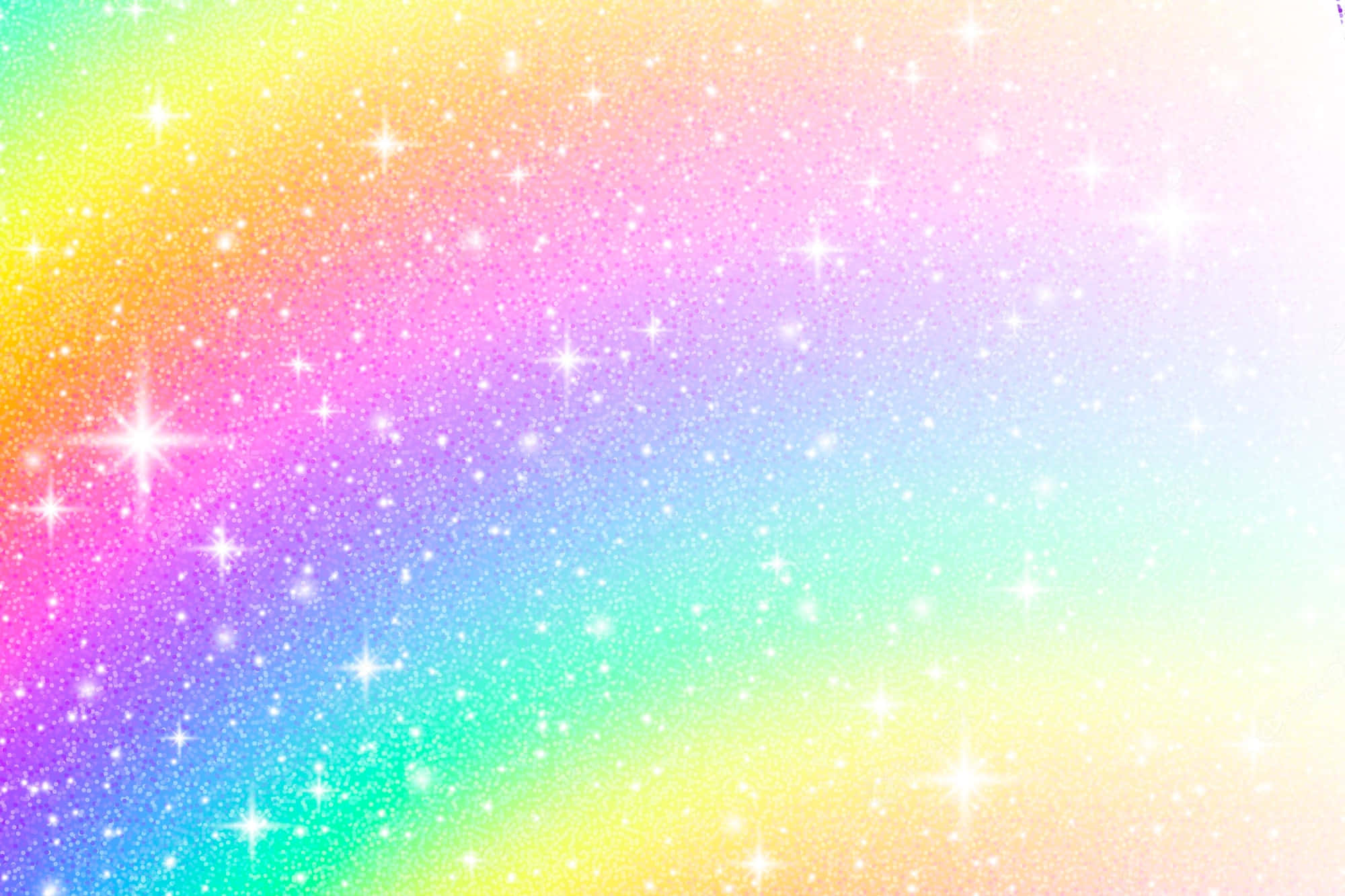 Glittery 桌布 壁紙 — 充滿閃爍亮片和閃爍星星的鮮豔彩虹漸變天空，營造出神奇的宇宙效果。