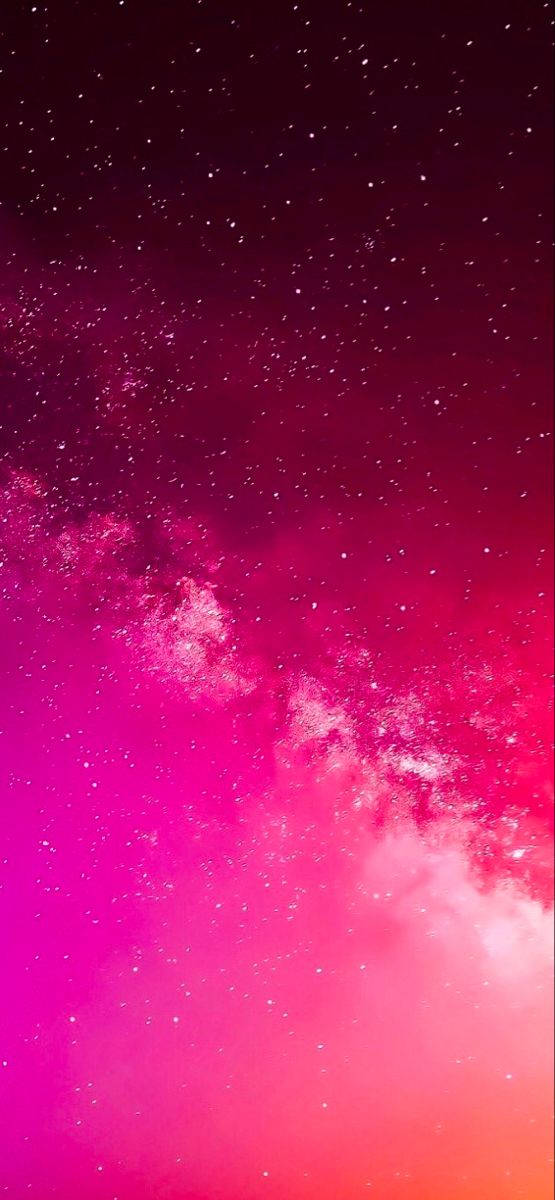 Hot Pink Aesthetic 桌布 壁紙 — 充滿閃爍星星的鮮豔粉紅和洋紅色宇宙星雲，橫跨深邃的太空景觀。