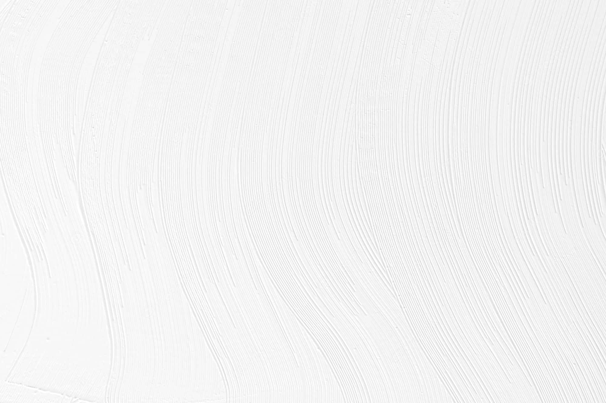 White Color 桌布 壁紙 — 光滑白色油漆的近距離特寫，帶有柔和波浪狀的筆觸，營造出極簡紋理表面。