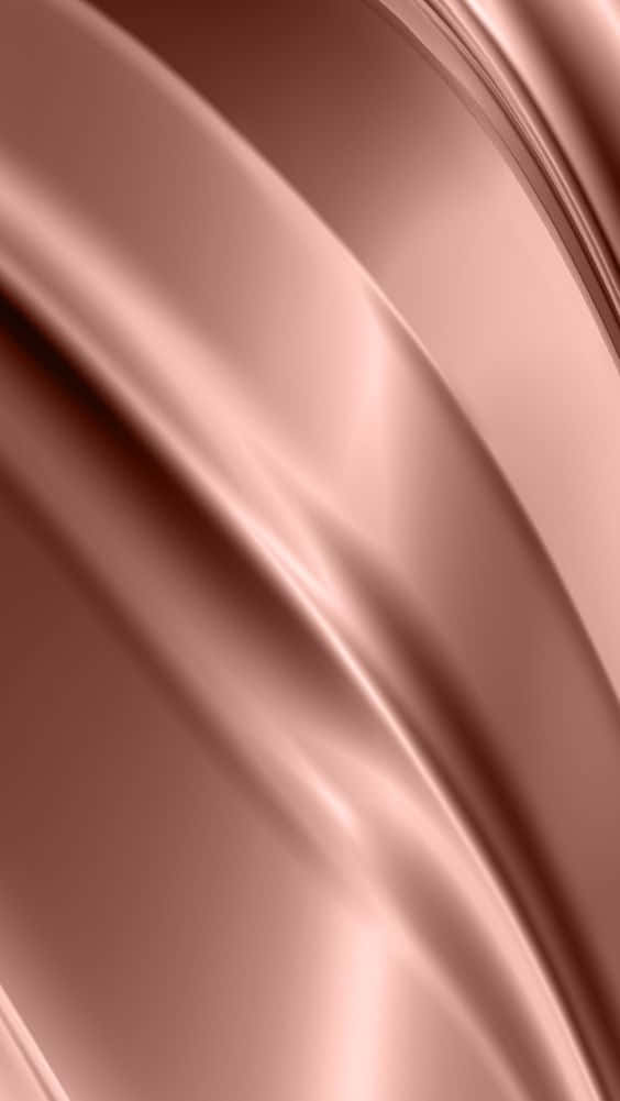 Rose Gold Color 桌布 壁紙 — 光滑的玫瑰金色布料以柔和起伏的波浪流動，帶有輕柔的高光和陰影。