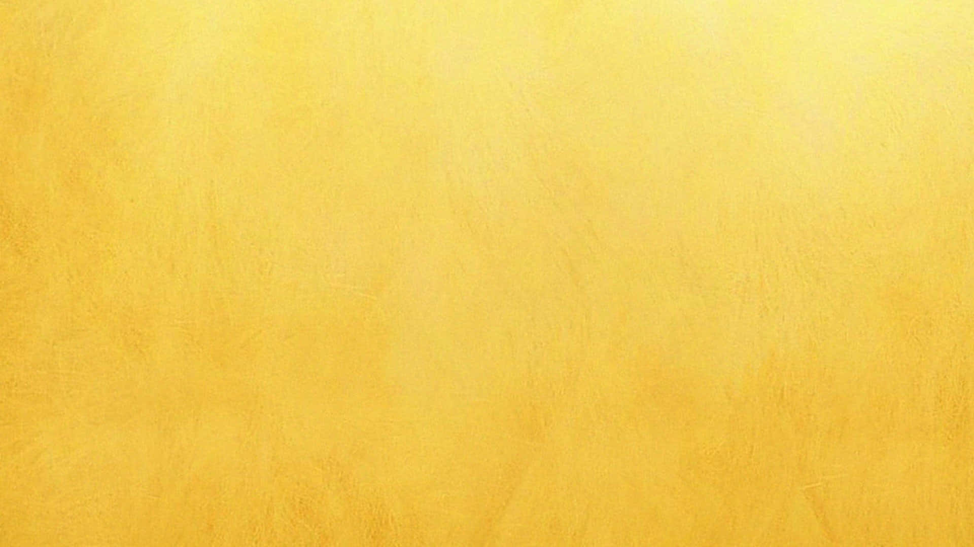 Plain Yellow 桌布 壁紙 — 光滑紋理的金黃色表面，帶有微妙的色調變化和柔和的筆觸圖案。