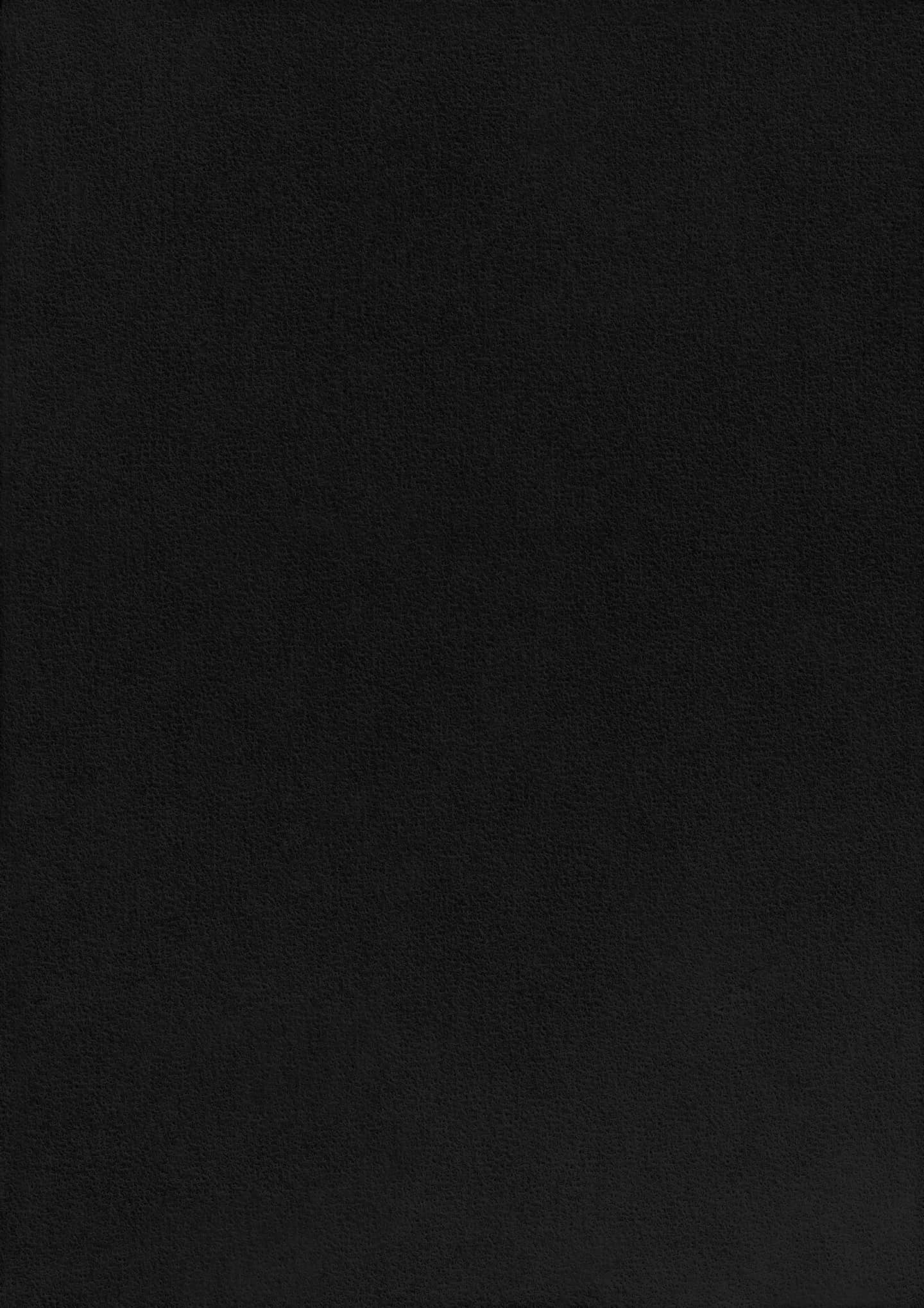 Black Paper Texture 桌布 壁紙 — 光滑黑色皮革表面的特寫，帶有細微的粒面紋理和柔和的光線。