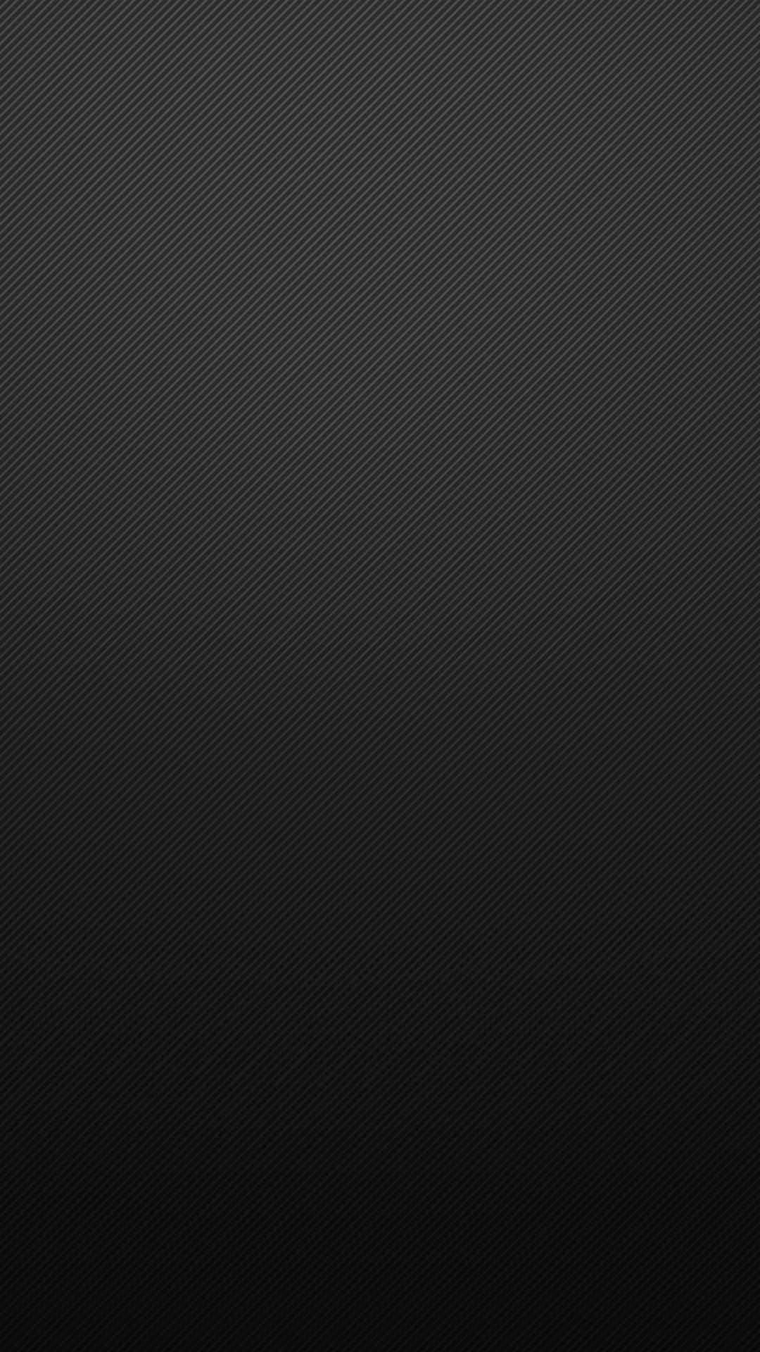 Carbon Fiber iPhone 桌布 壁紙 — 光滑黑色碳纖維紋理，帶有對角線條，逐漸淡入更深陰影。