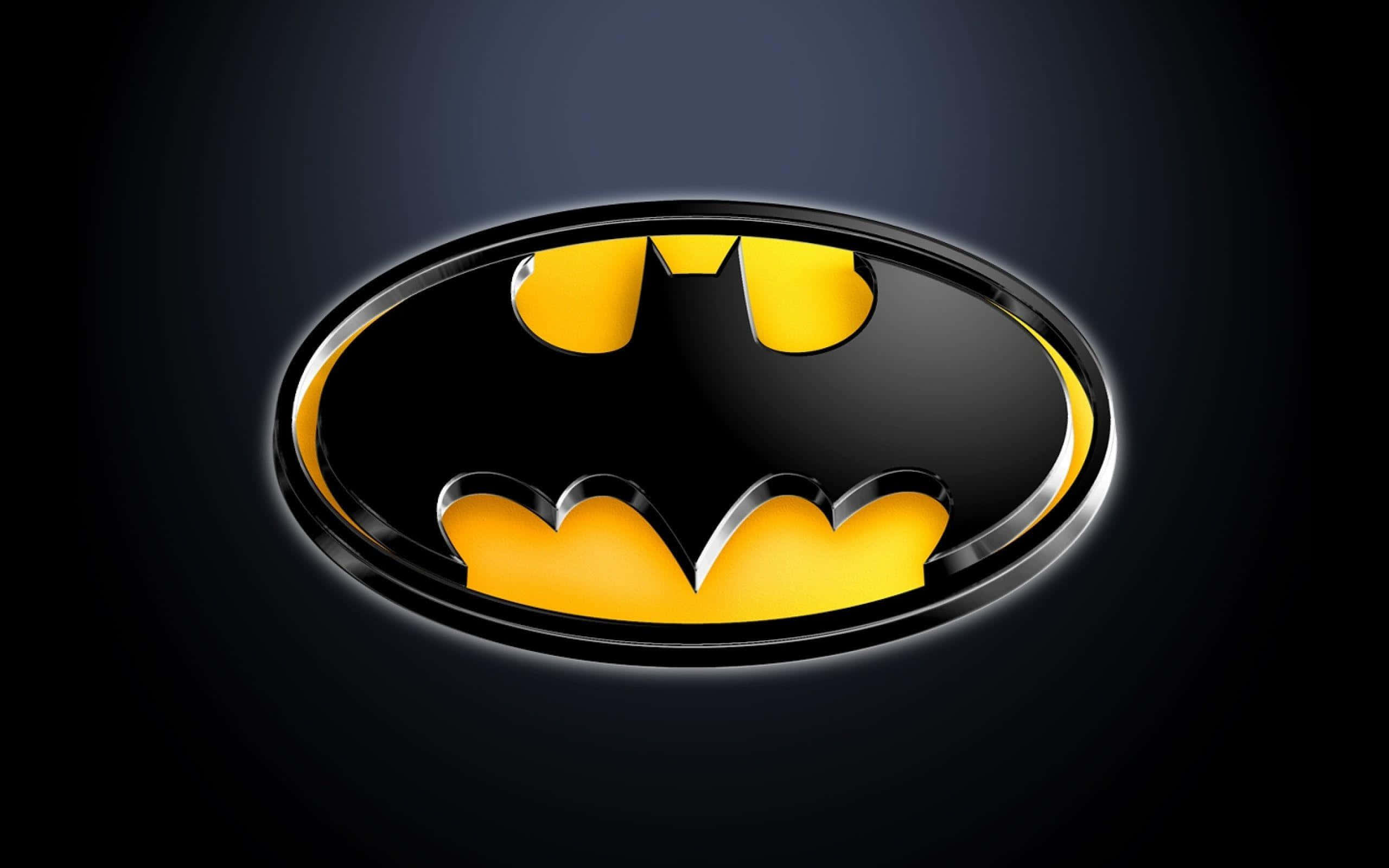 bat 桌布 壁紙 — 光澤黑色和黃色蝙蝠符號標誌，居中於帶柔和光暈的深色漸變背景上。