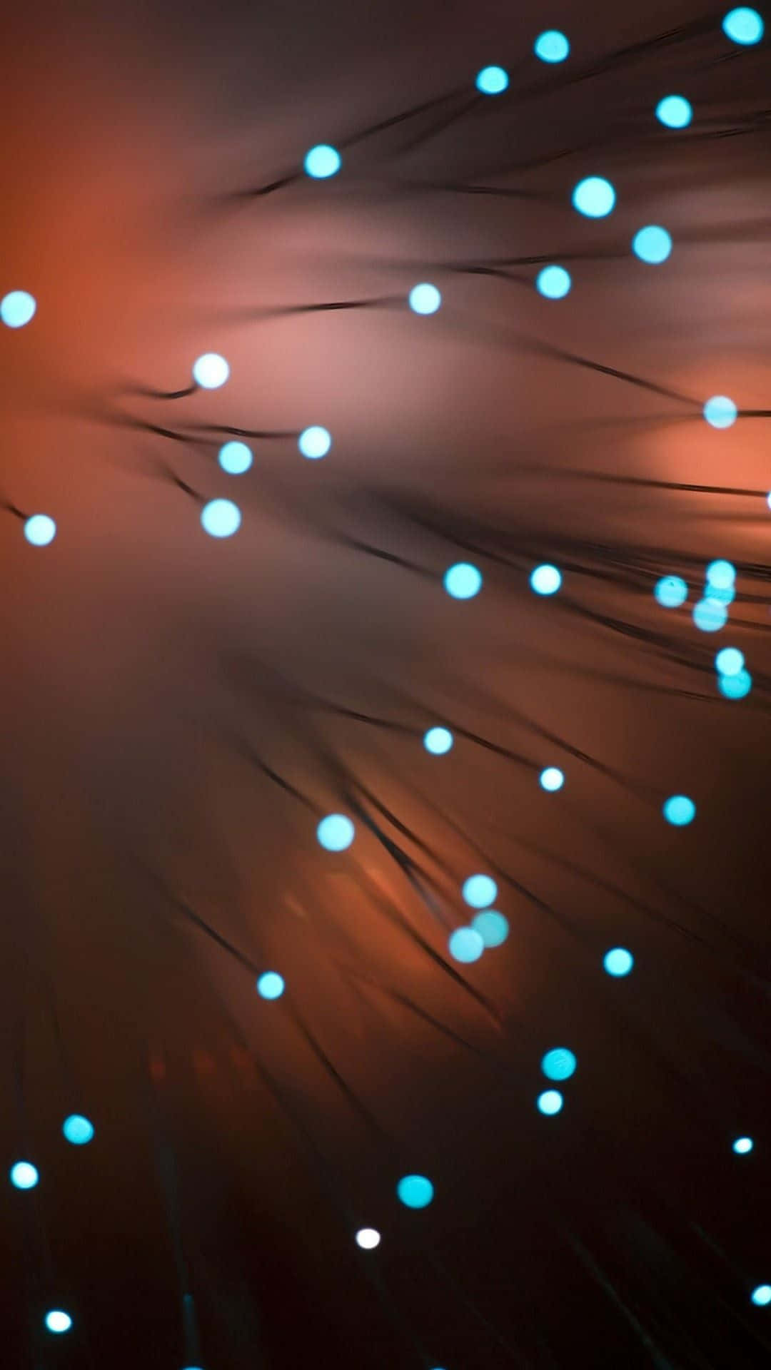Light 桌布 壁紙 — 光纖線束在溫暖的琥珀色背景下發出冷藍色光芒，營造出未來感的抽象圖案。