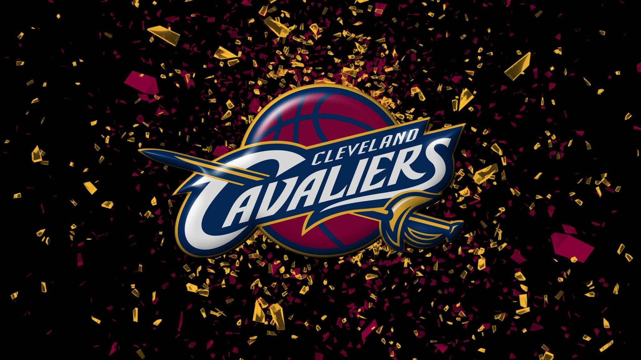 cavaliers 桌布 壁紙 — 克里夫蘭騎士隊標誌在黑色背景上爆發出金色和洋紅色的五彩紙屑。