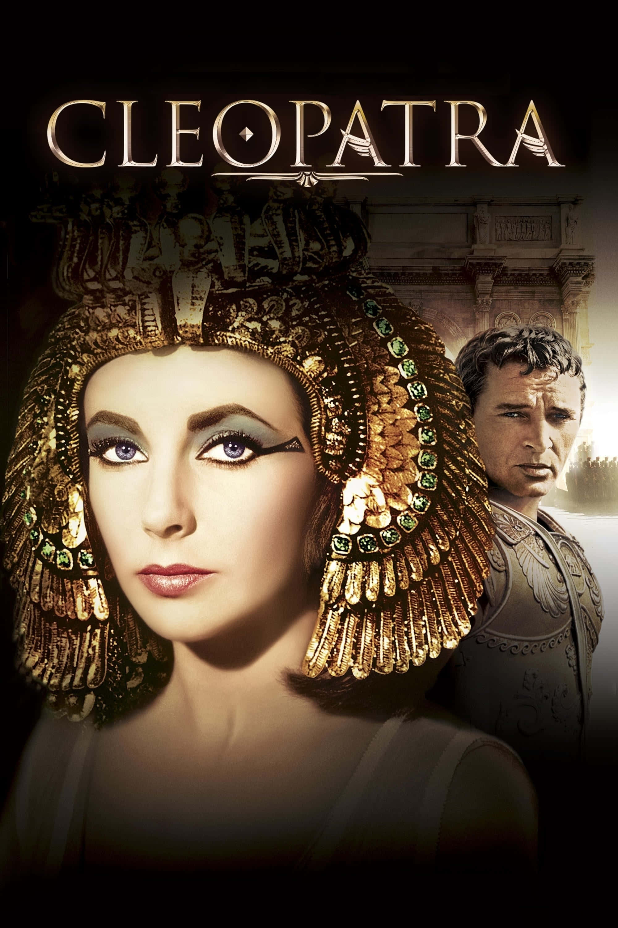 Cleopatra 桌布 壁紙 — 克麗奧佩特拉華麗的肖像，戴著華麗的金色頭飾，飾有祖母綠寶石，旁邊是一位身穿盔甲的羅馬士兵，背景是神廟。