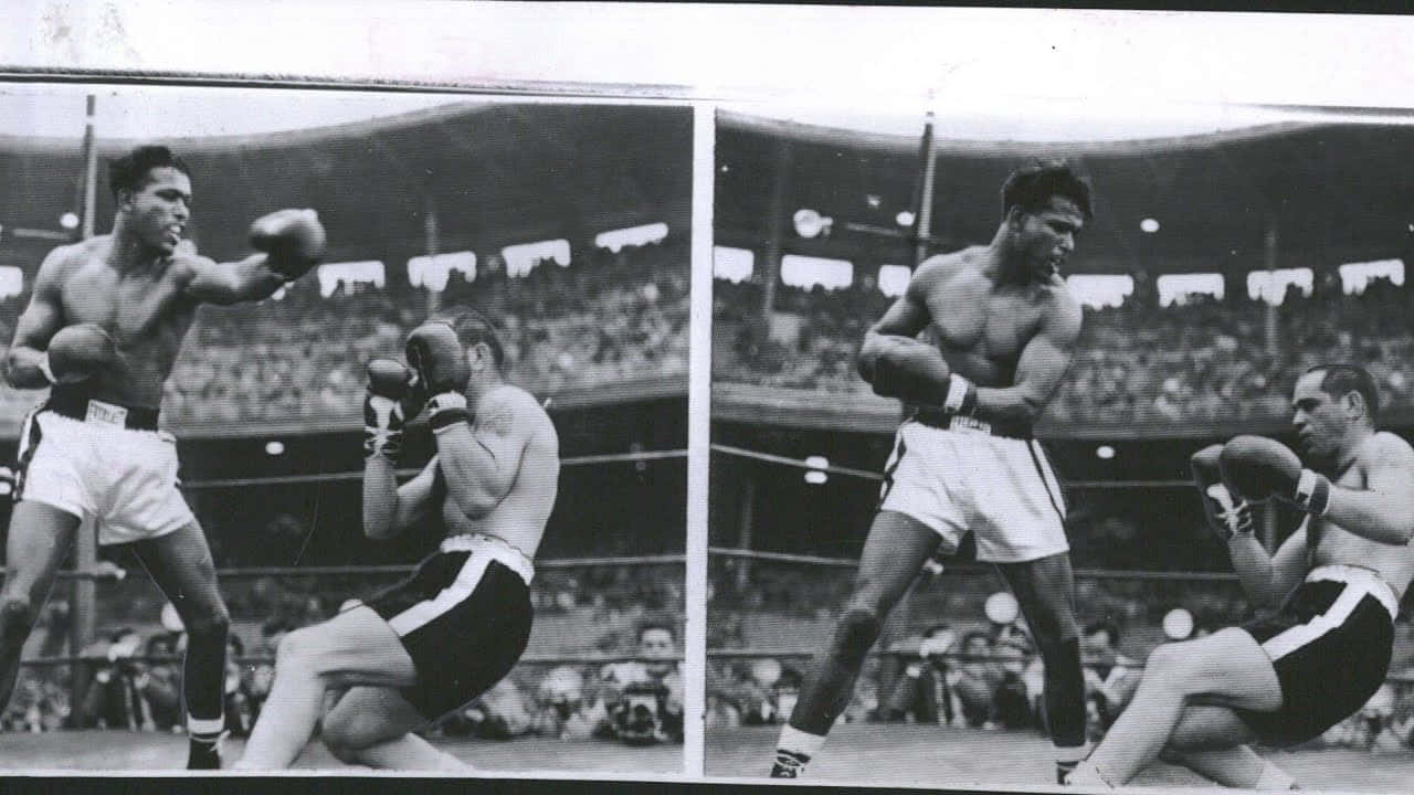 Boxing 桌布 壁紙 — 兩位拳擊手在粗糙的黑白擂台上交鋒，背景是咆哮的人群。