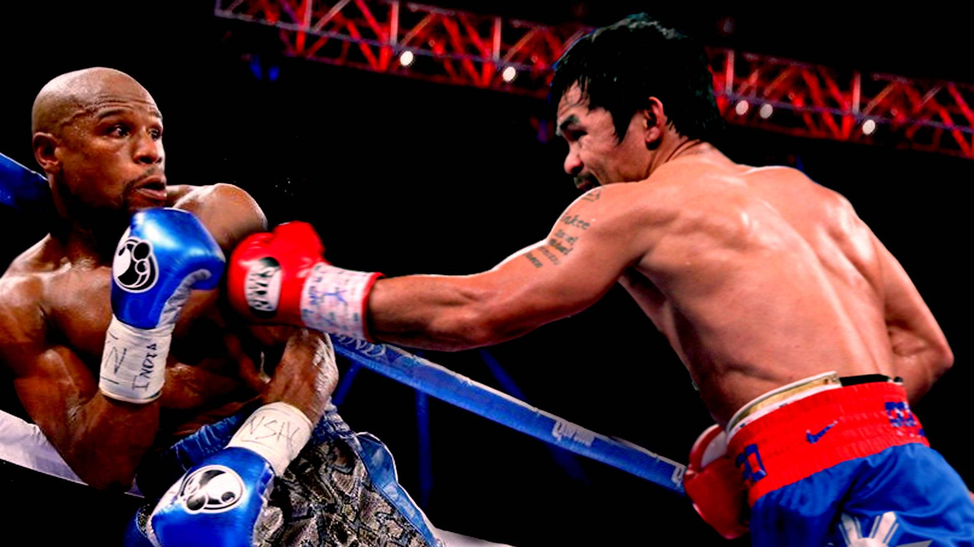 Boxing 桌布 壁紙 — 兩位肌肉發達的拳擊手在一個戲劇性的擂台上碰撞，頭頂有紅色桁架燈光。