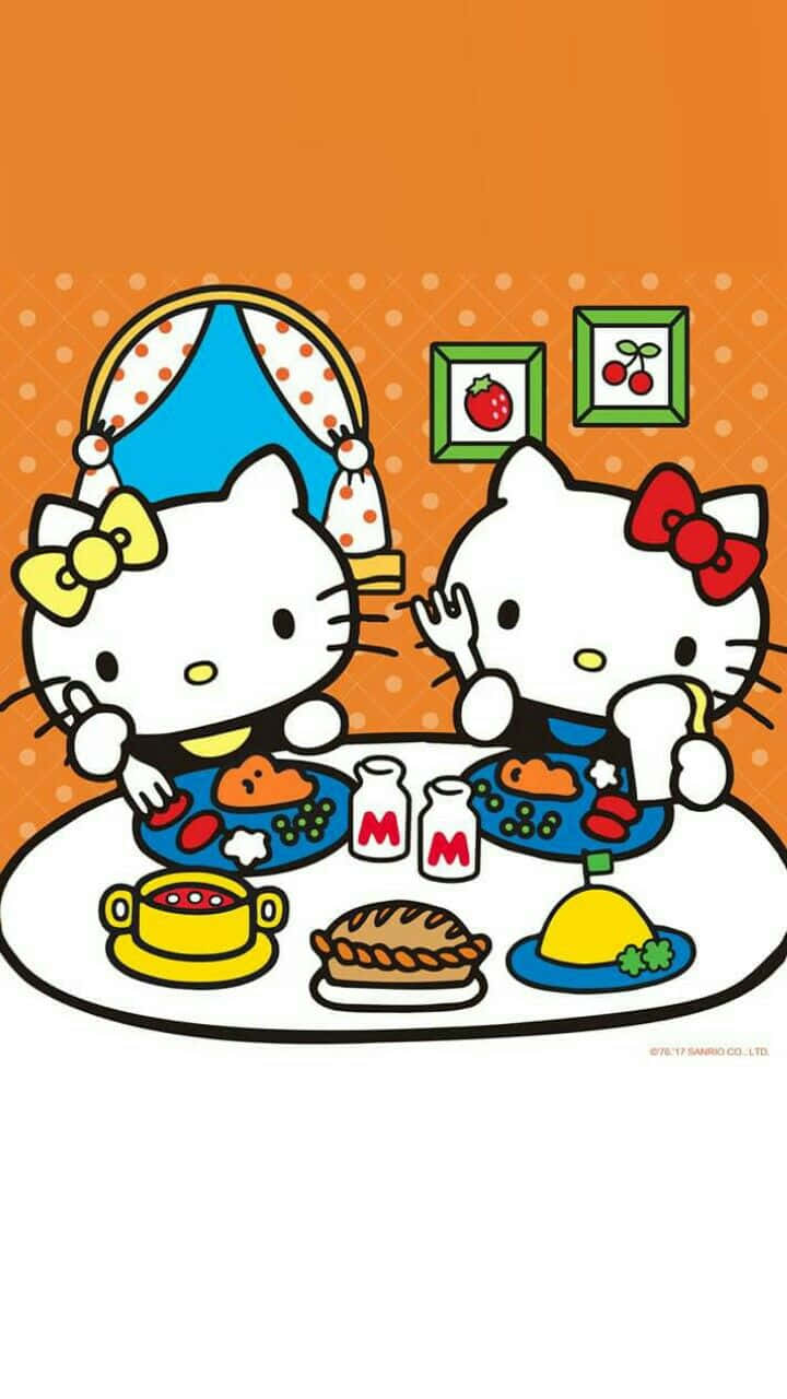 Hello Kitty Thanksgiving 桌布 壁紙 — 兩個Hello Kitty角色在橙色圓點牆前，享用桌上色彩繽紛的餐點，包括派和飲料。